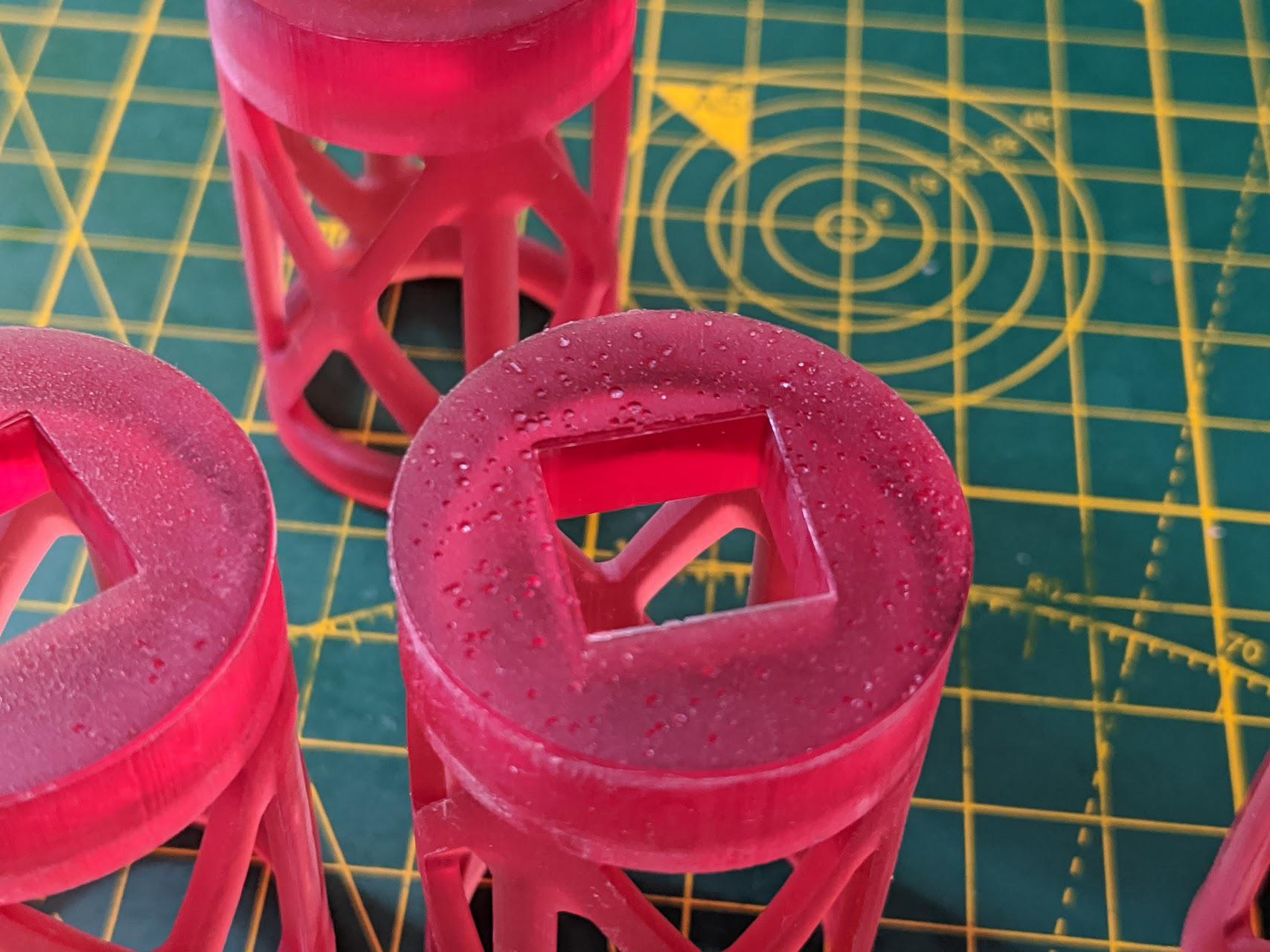 "Pot holes" on bottom layer of resin prints (Not support marks) r