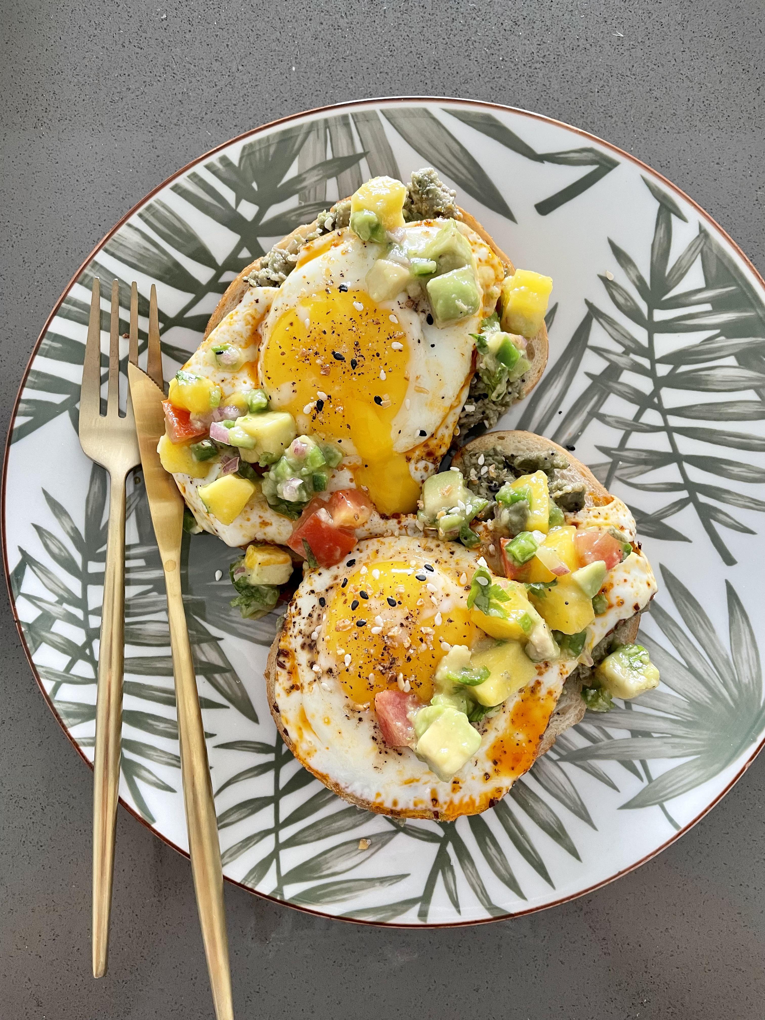 Good ol’ avo toast, topped with sunny side eggs fried in chili oil