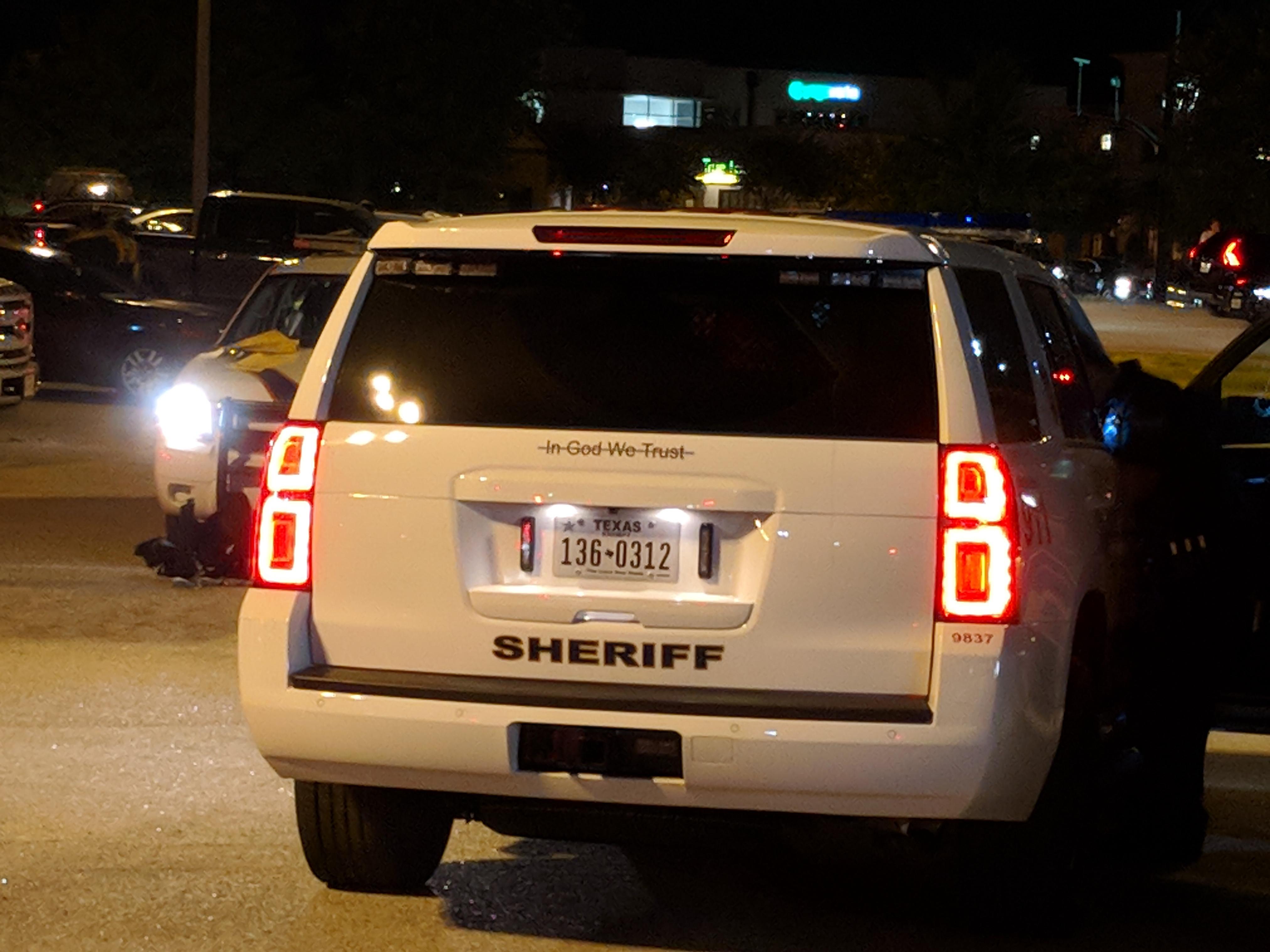 Woodlands cop cars have "in God we trust" crossed out houston