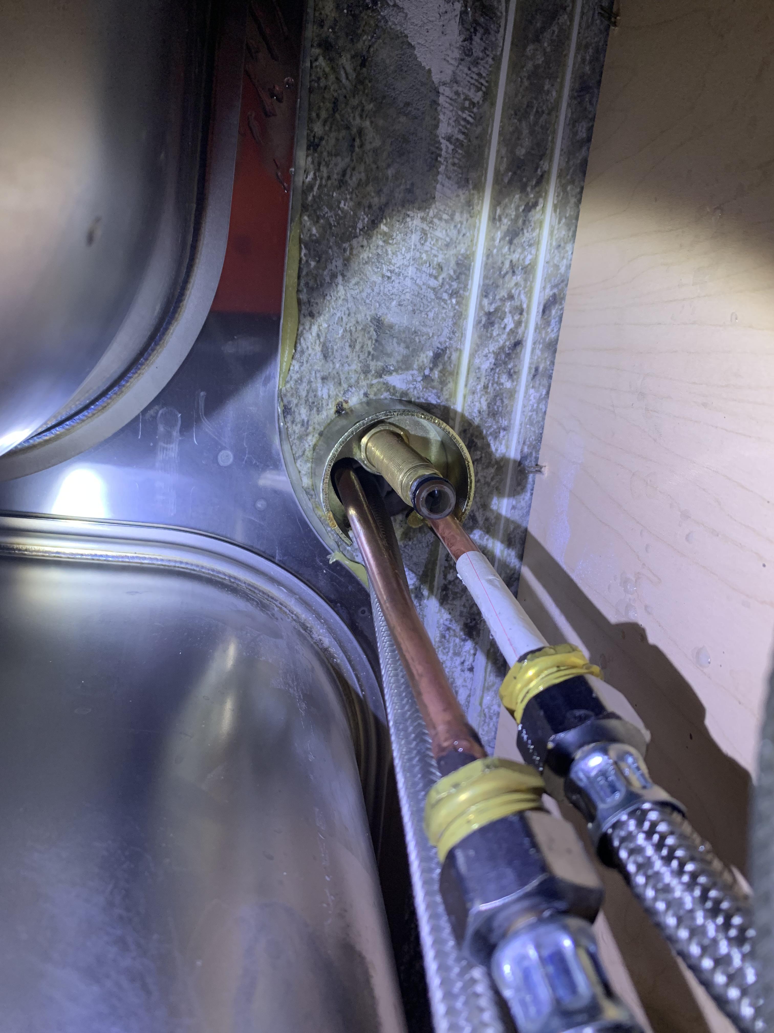 I am about to remove an old Delta kitchen faucet. How can I remove the