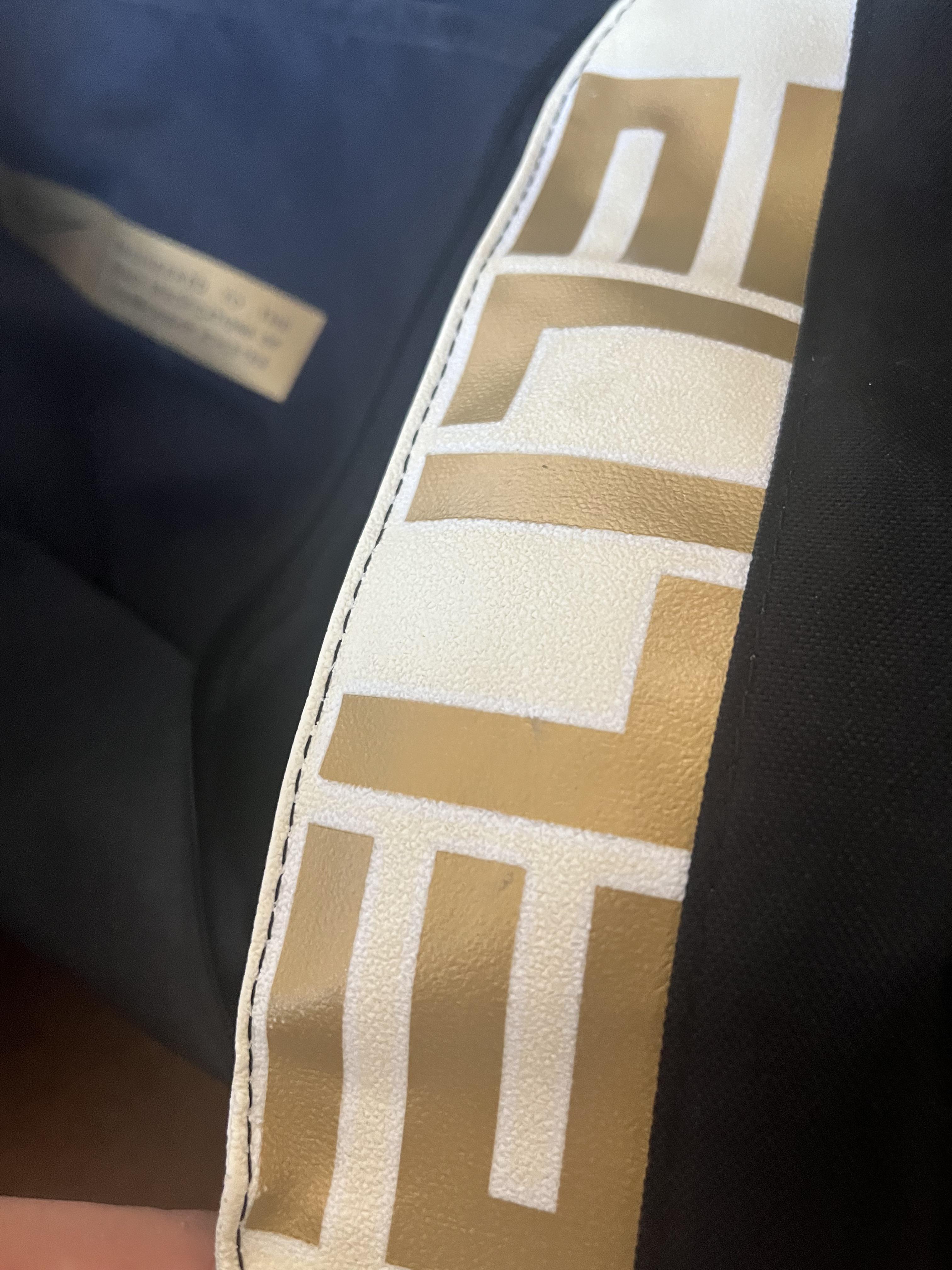 How do I clean the yellowed white part of my Nike elite bag (the part