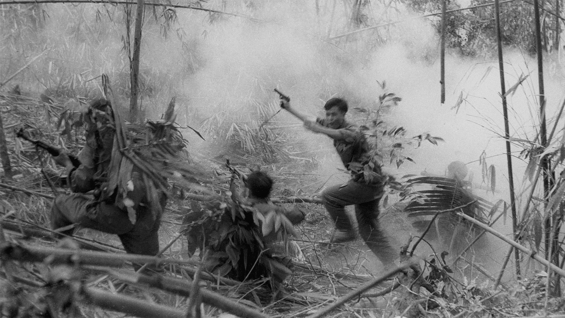 North Vietnamese Army officer leads an attack on South Vietnamese