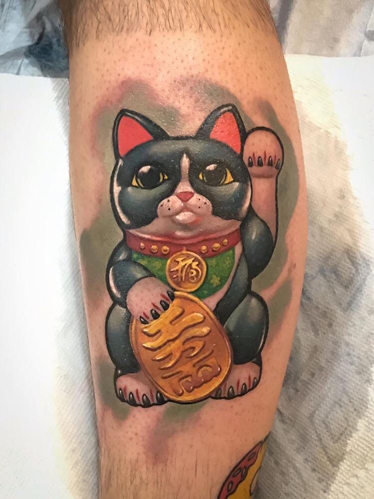 [japanese > english] what do the markings on this lucky cat translate