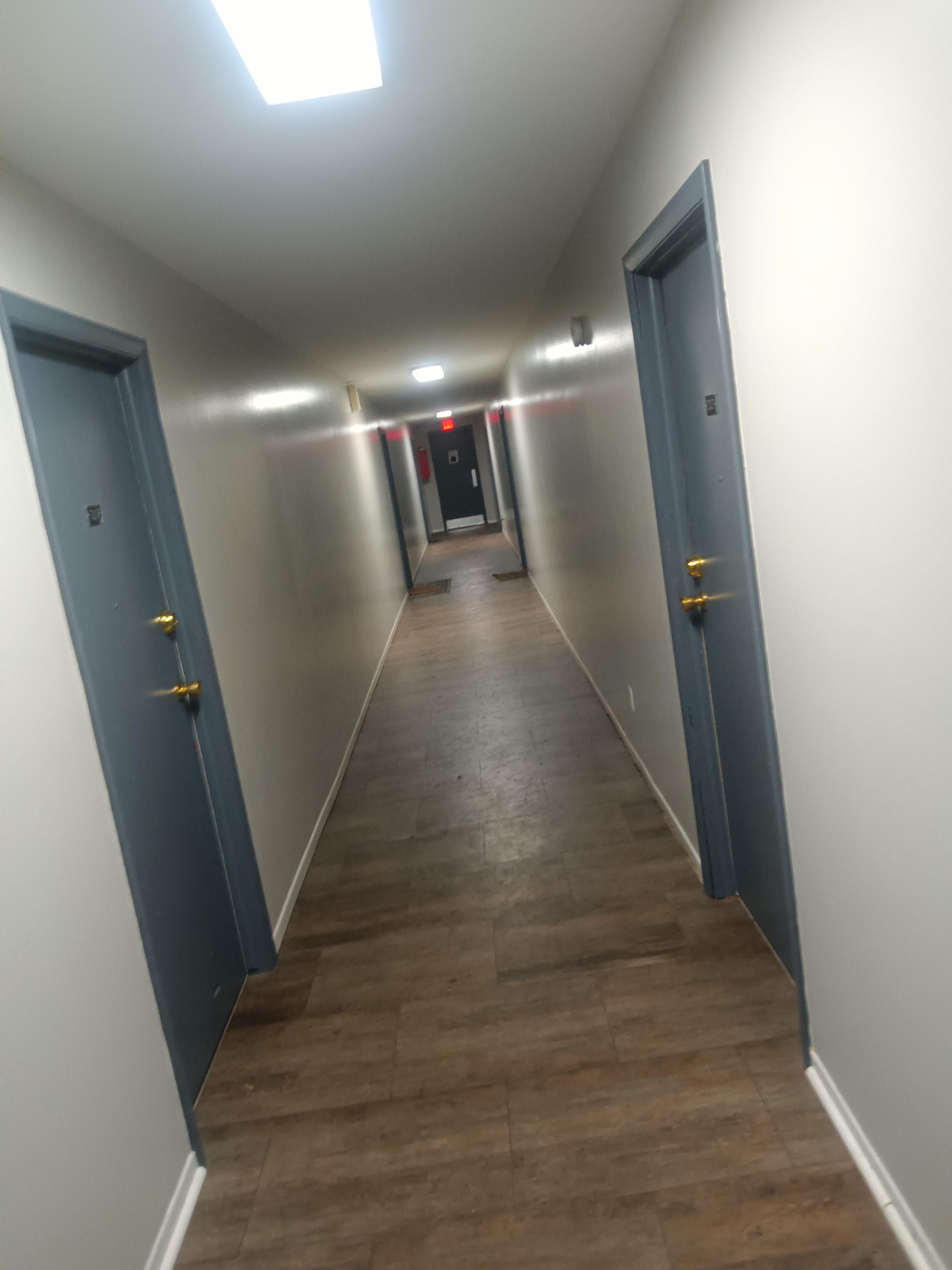 an endless apartment complex with doors that normally lead to a regular