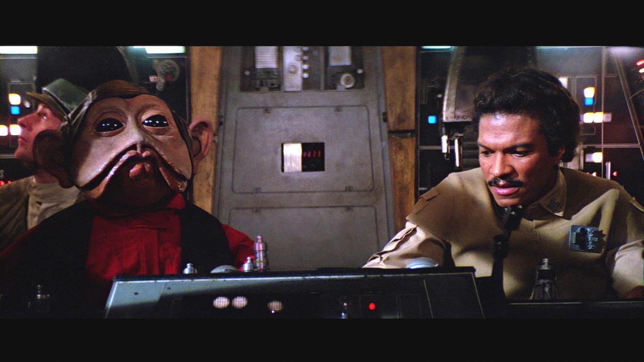 In Return of the Jedi (1983) the character Nien Nunb speaks an alien