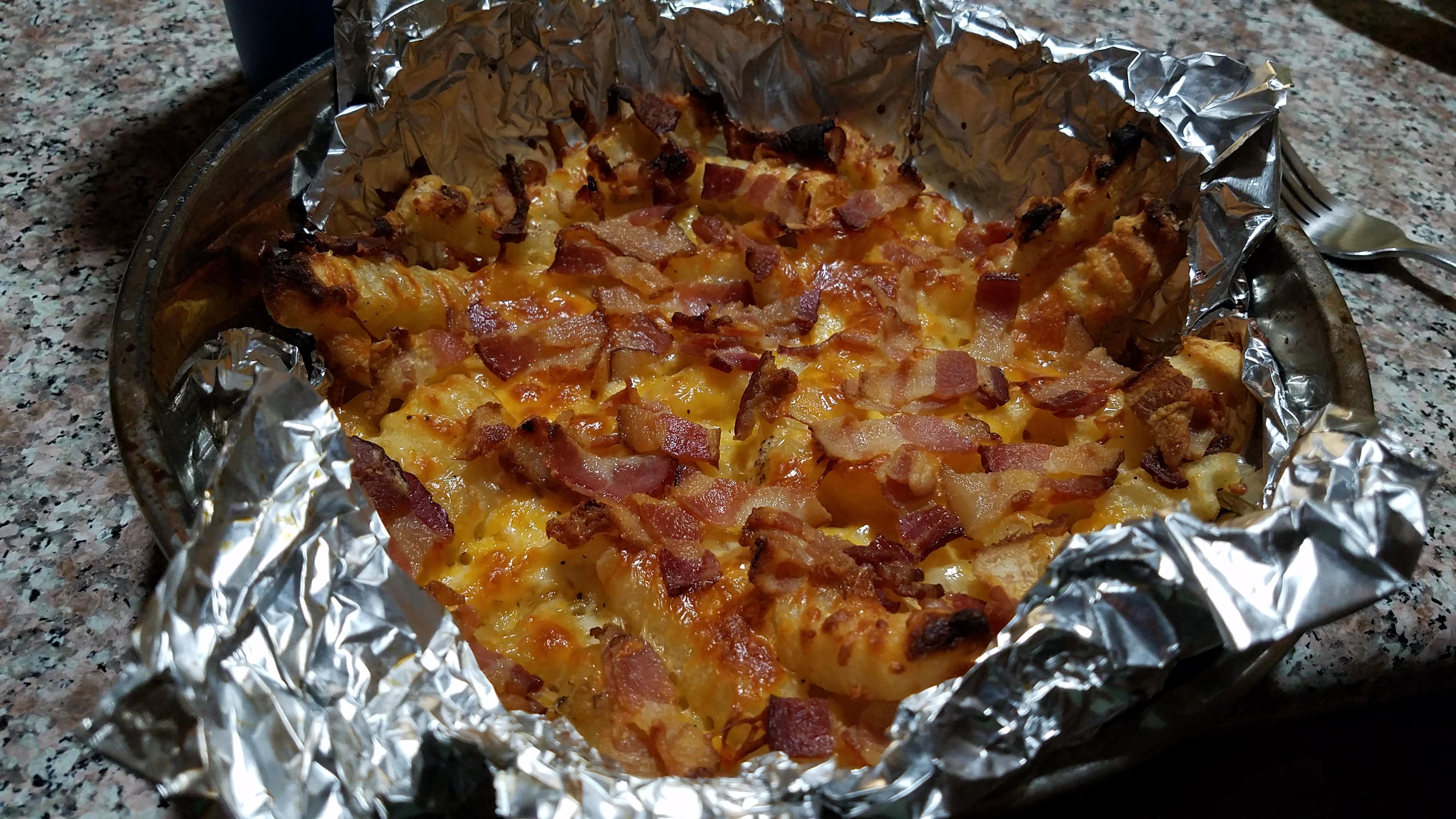 Oven crinklecut fries with bacon and a fifth of a bag of mexicanstyle