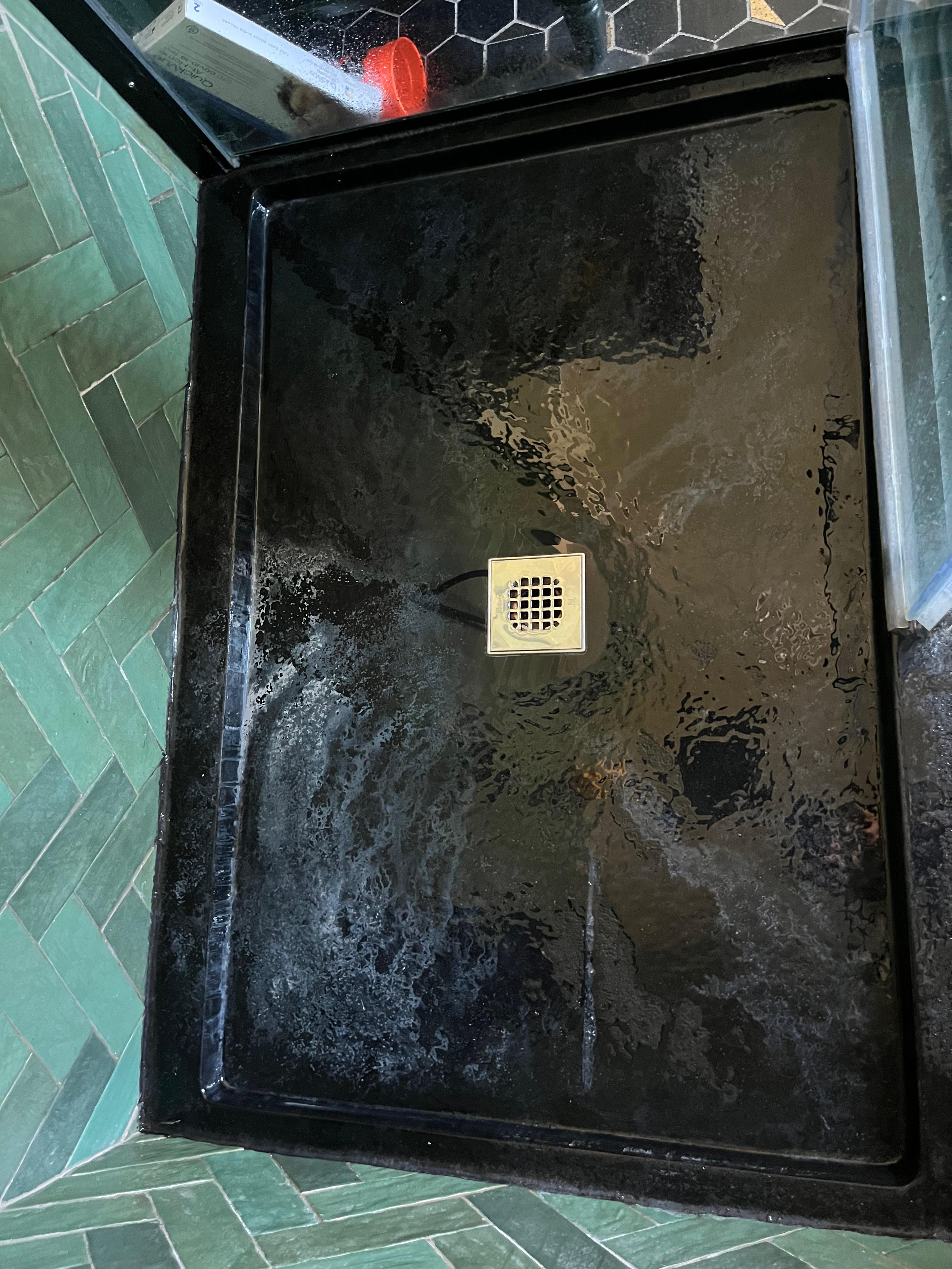 Need help removing hard water stains from textured black shower pan