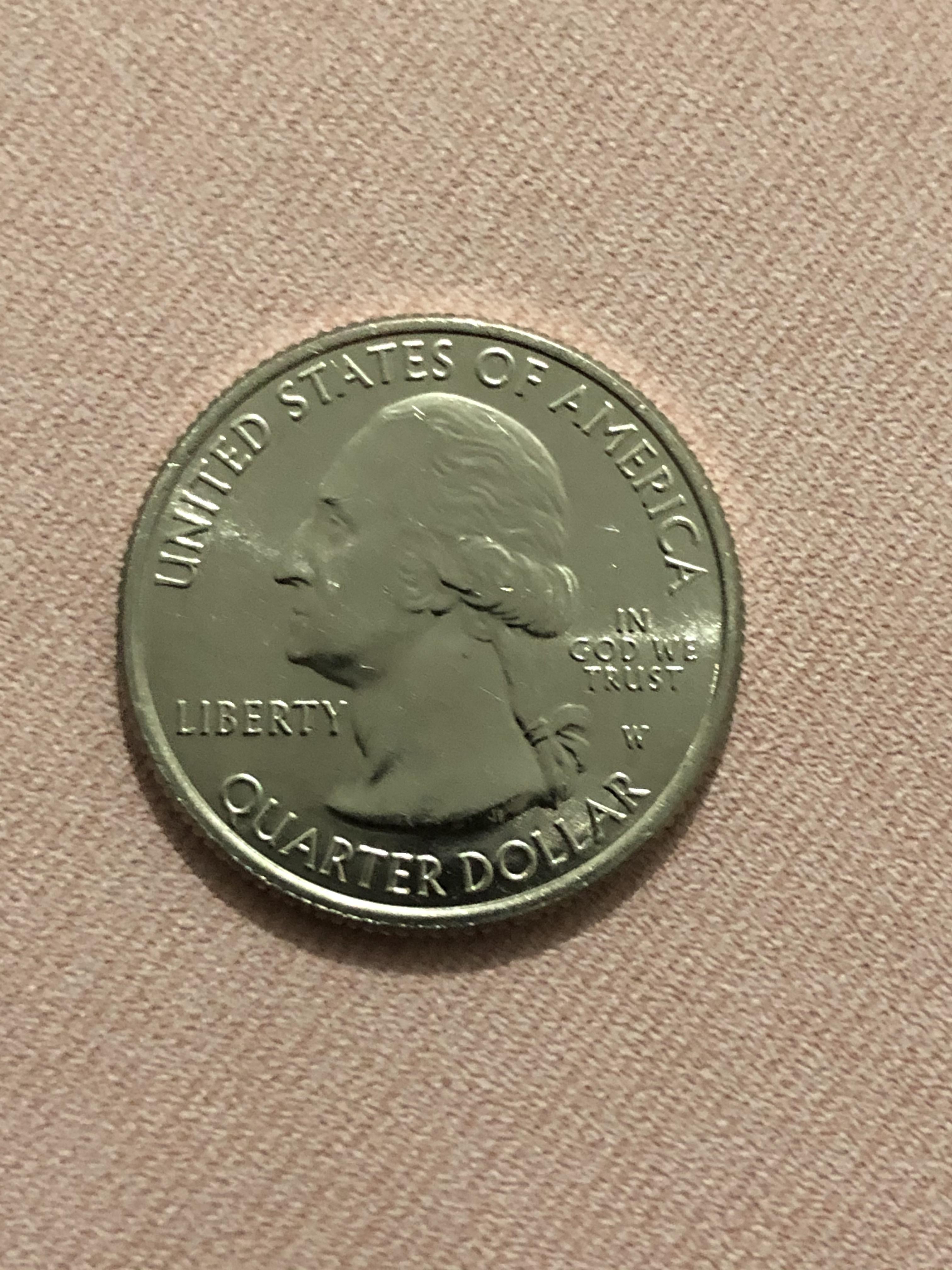 Finally found one while going through some coin rolls. coins