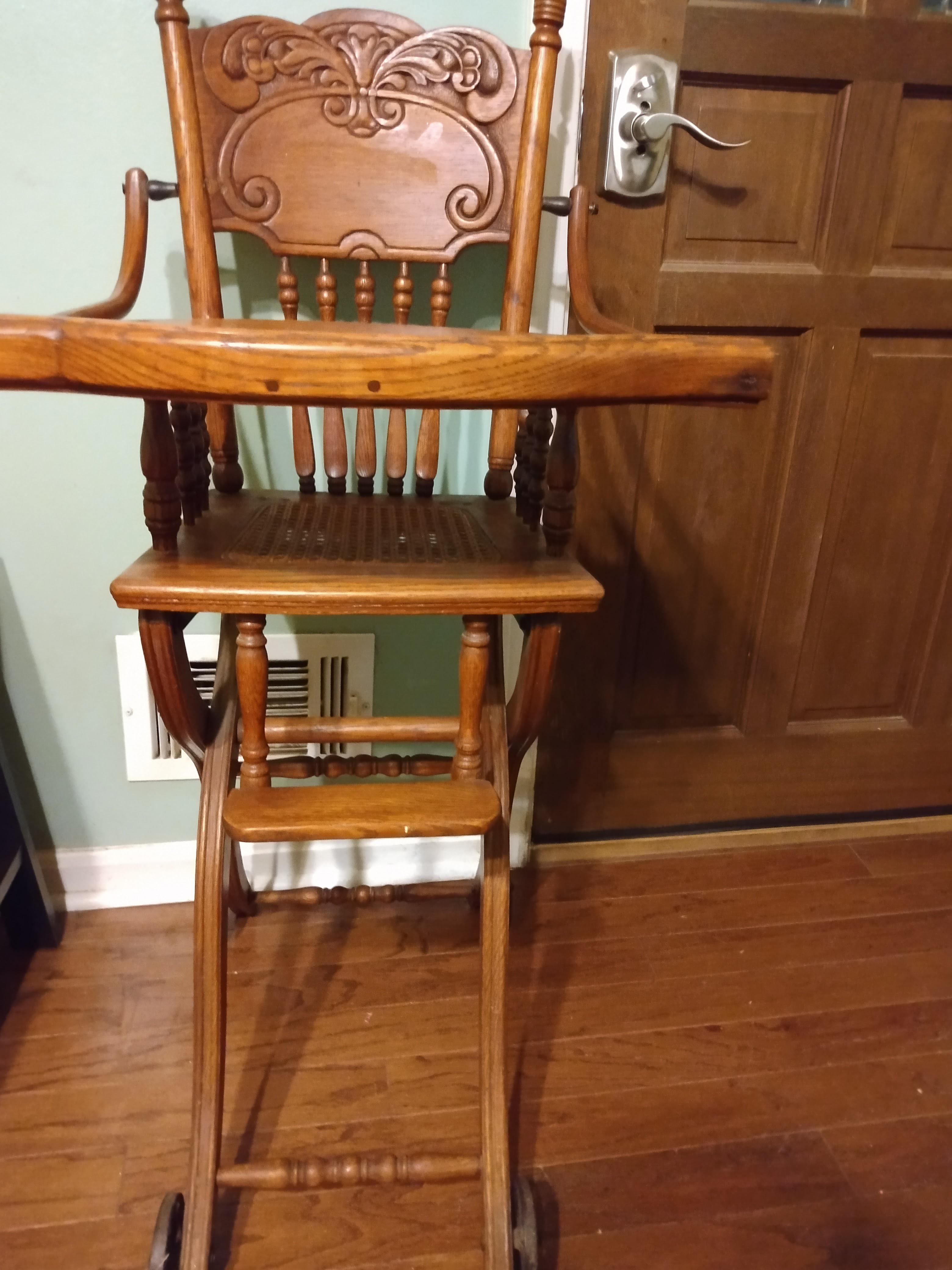 Antique high chair that has wheels/ converts into a child's walker. It