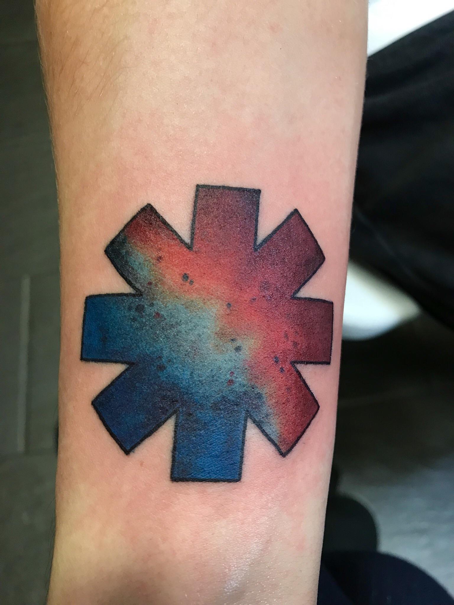 My first tattoo. The Red Hot Chili Peppers logo inspired by one of