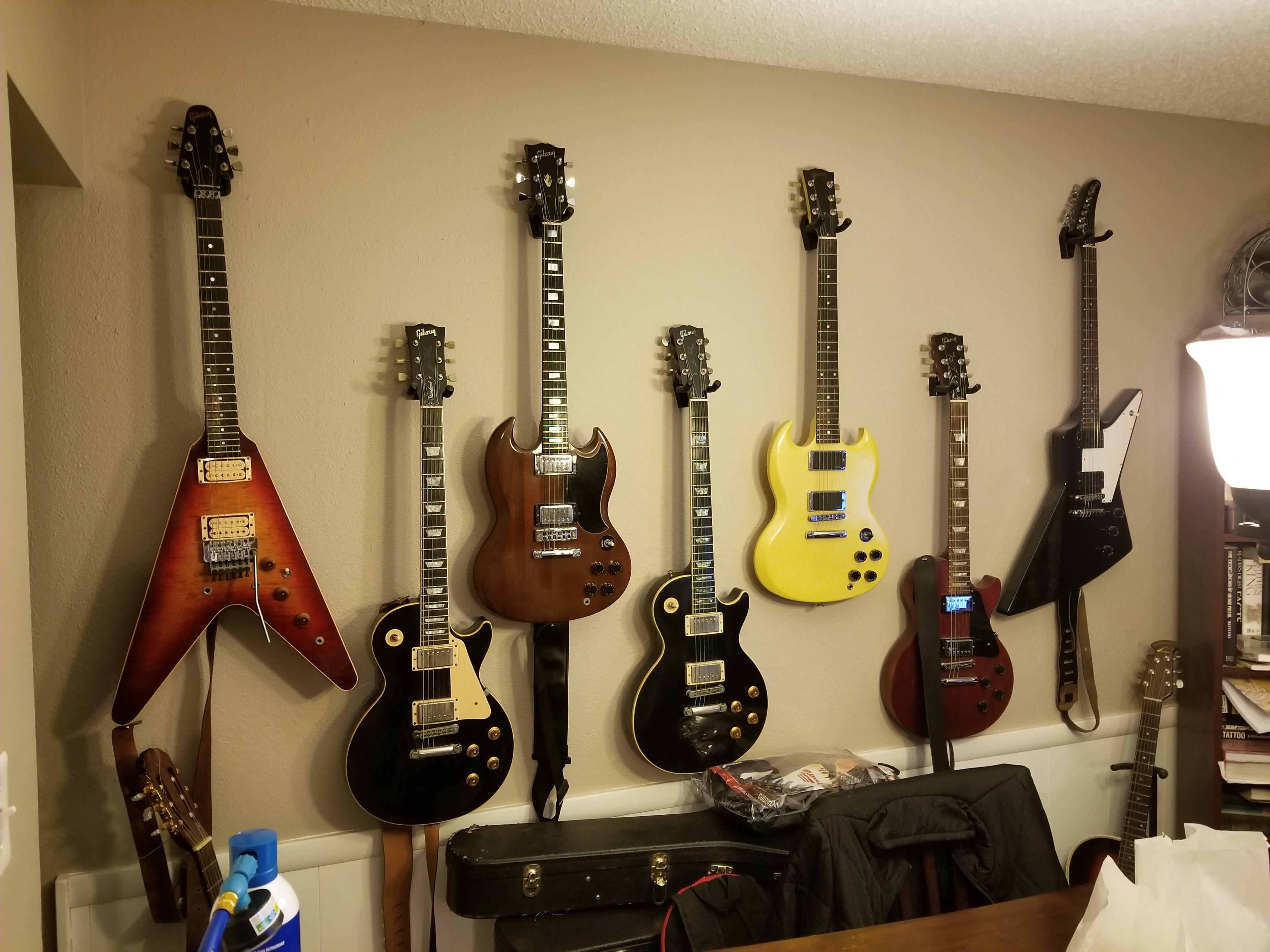 Wall of Gibsons...my happy place r/guitars