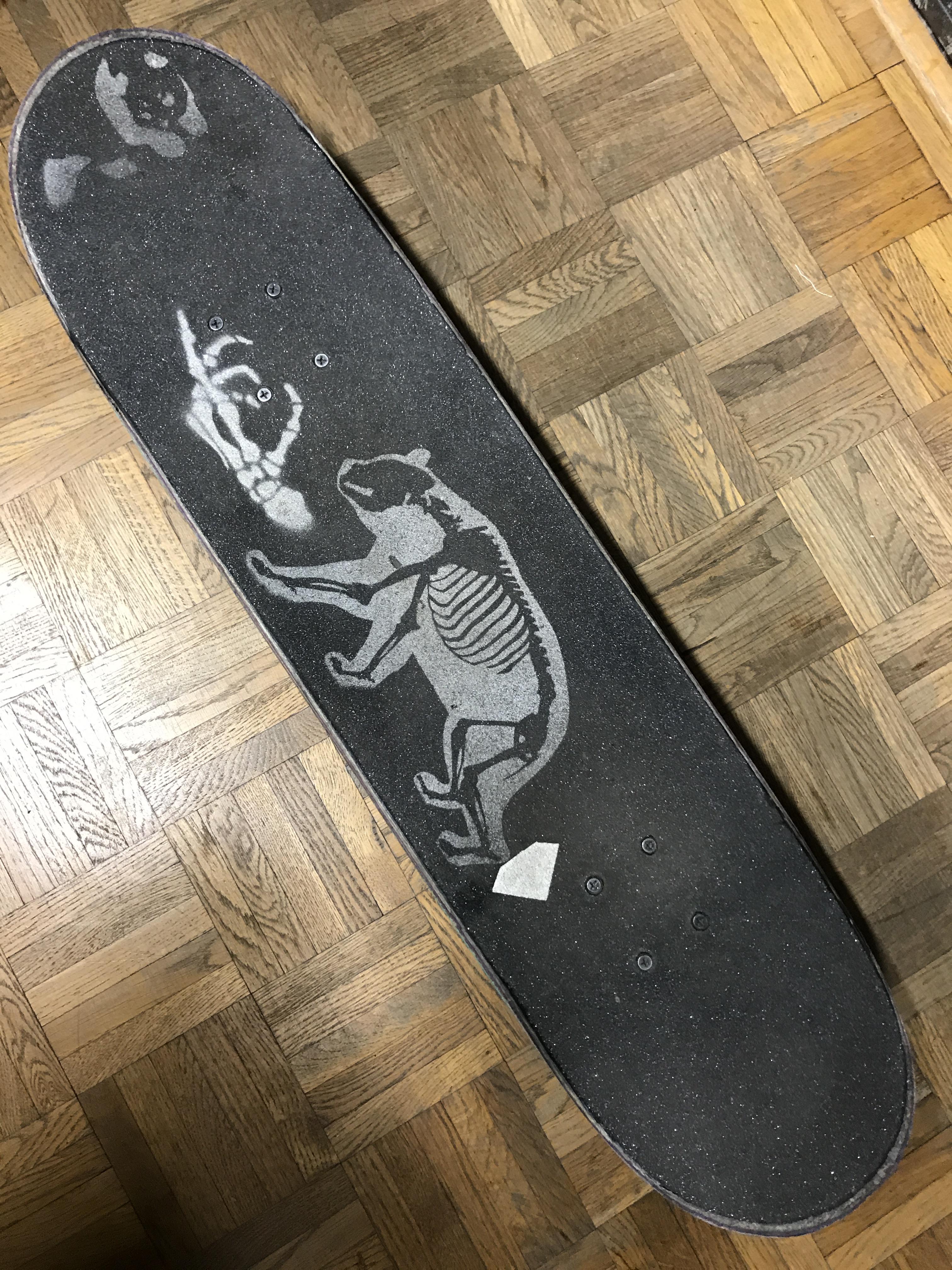 I used stencils and spray paint on my skateboard r/stencils