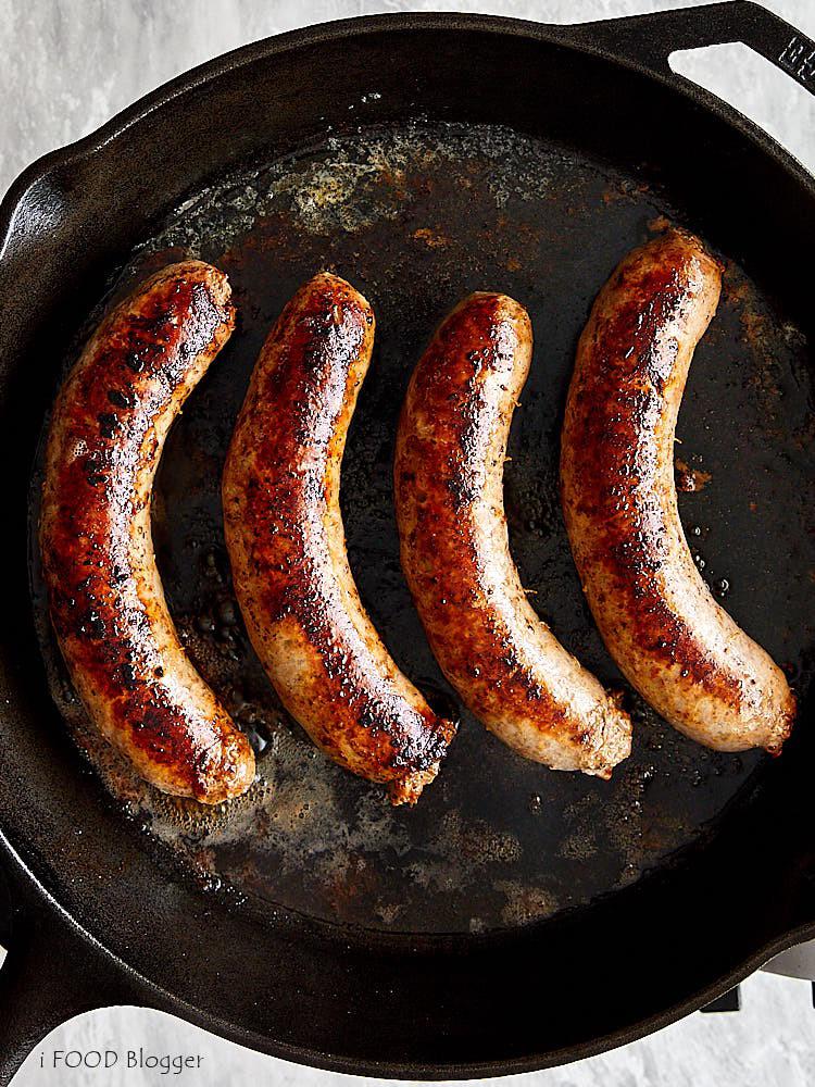 [50/50] Sausages sizzling on a cast iron pan (SFW) Guys searing their