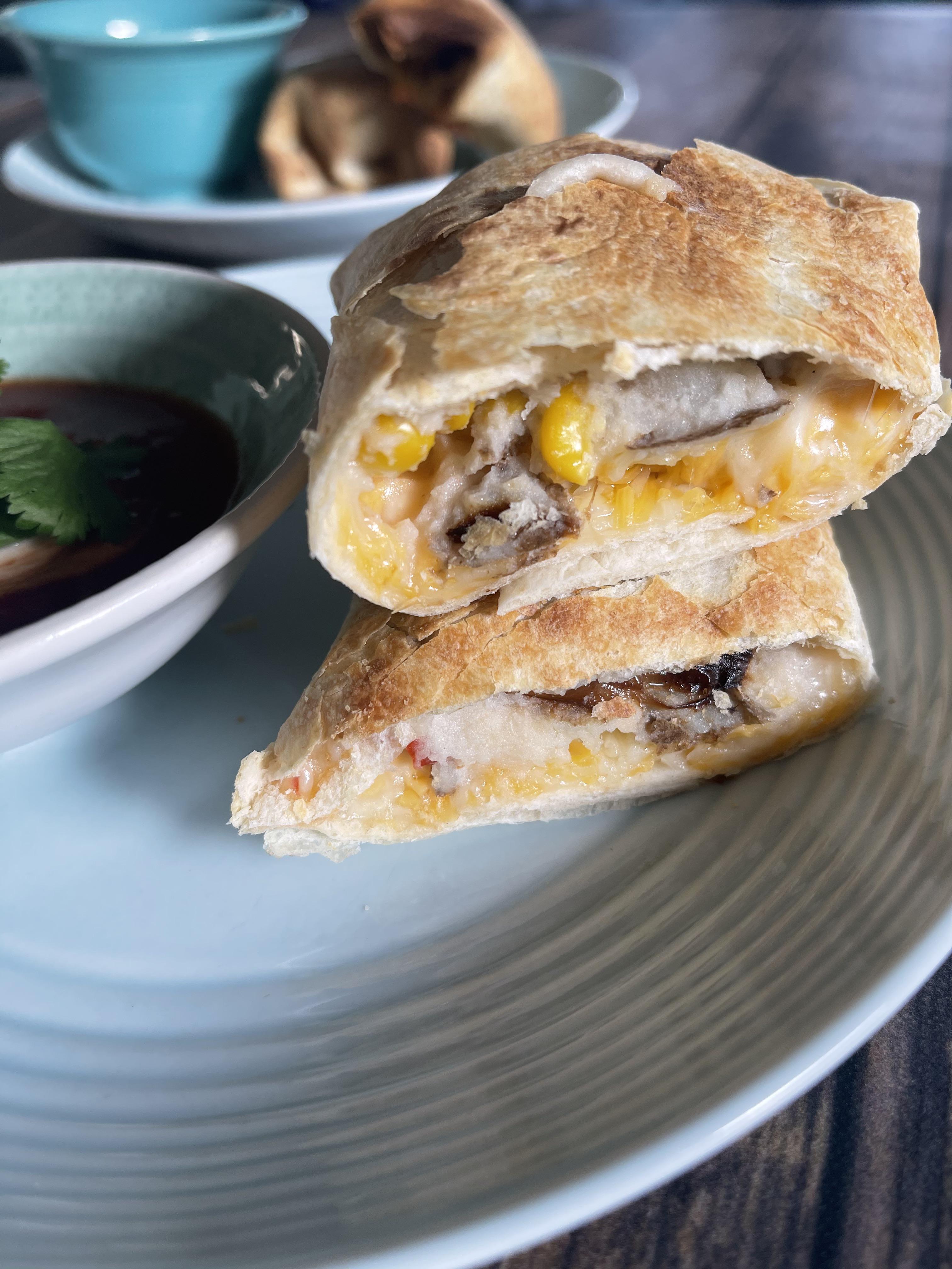 Roasted veggie and mashed potato flautas with creamy taco sauce! r