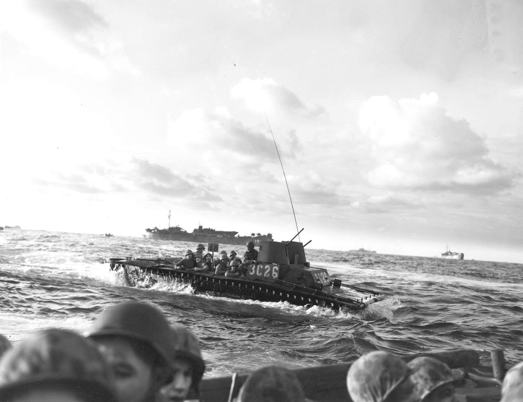Marines aboard an LVT(A)2 Water Buffalo quickly approaches the beaches