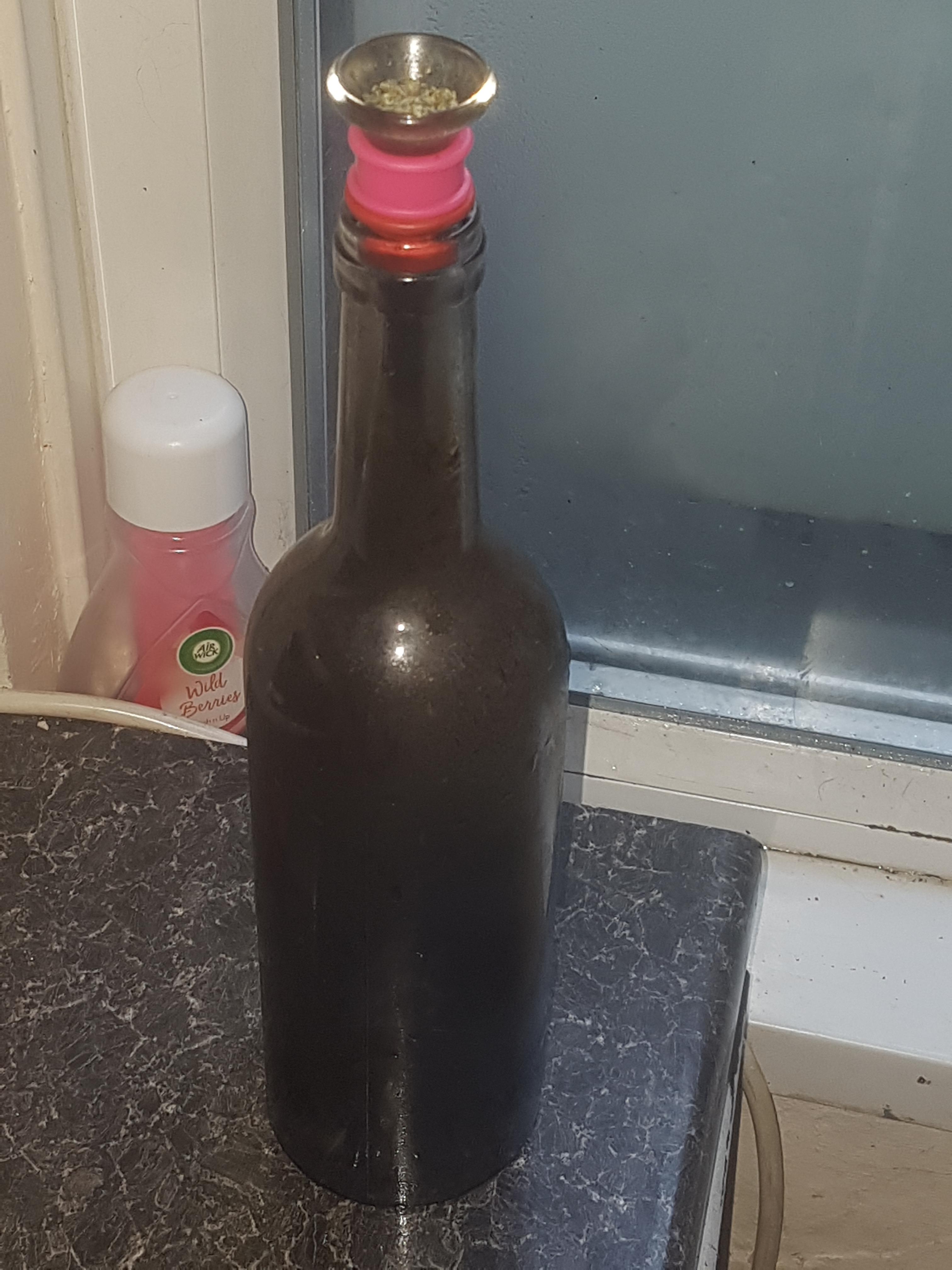 Homemade glass gravity bong, or "a bucket" as it's commonly known in