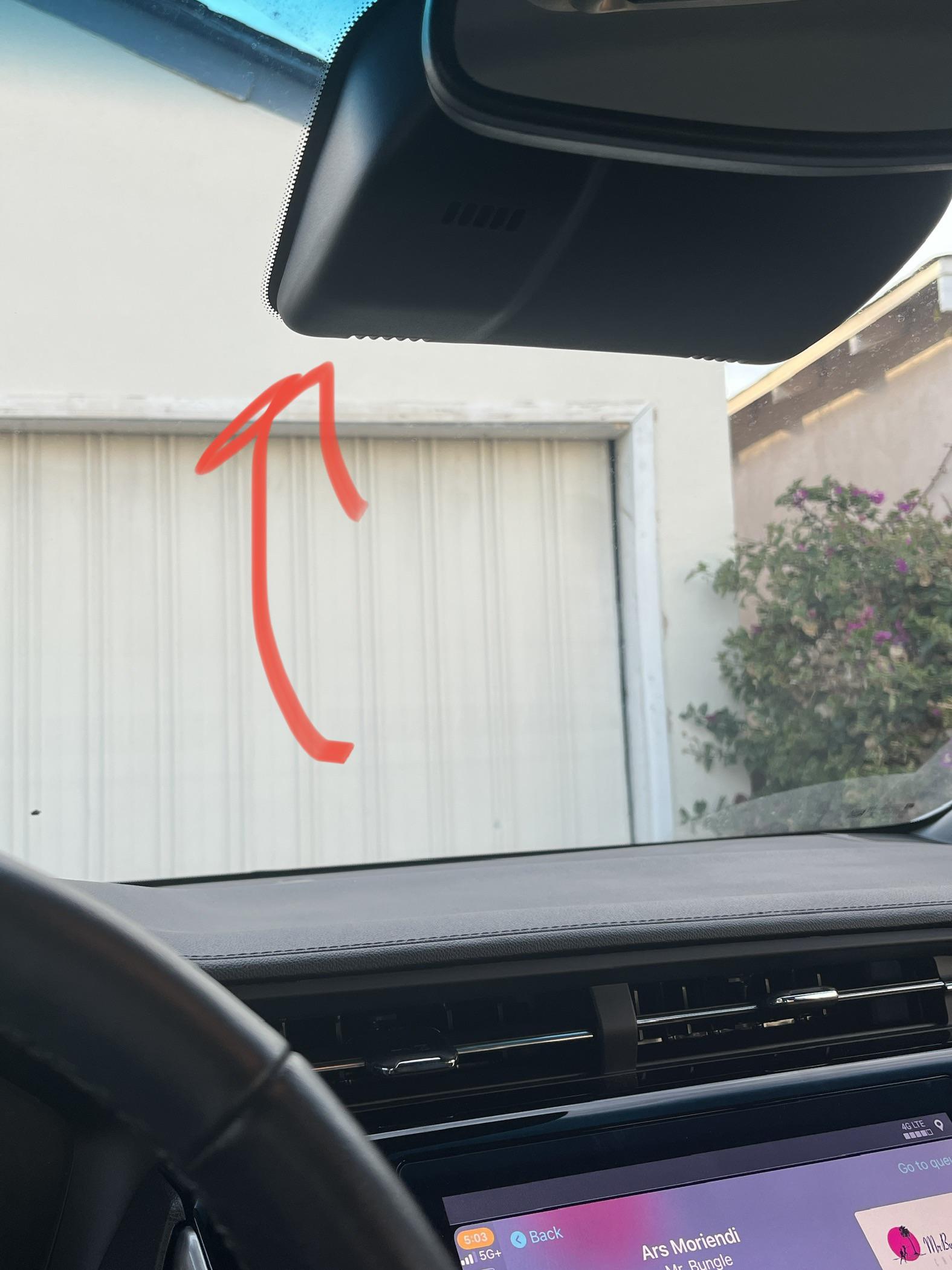 Plastic cover over windshield sensor rattles. Car is about 6 months old