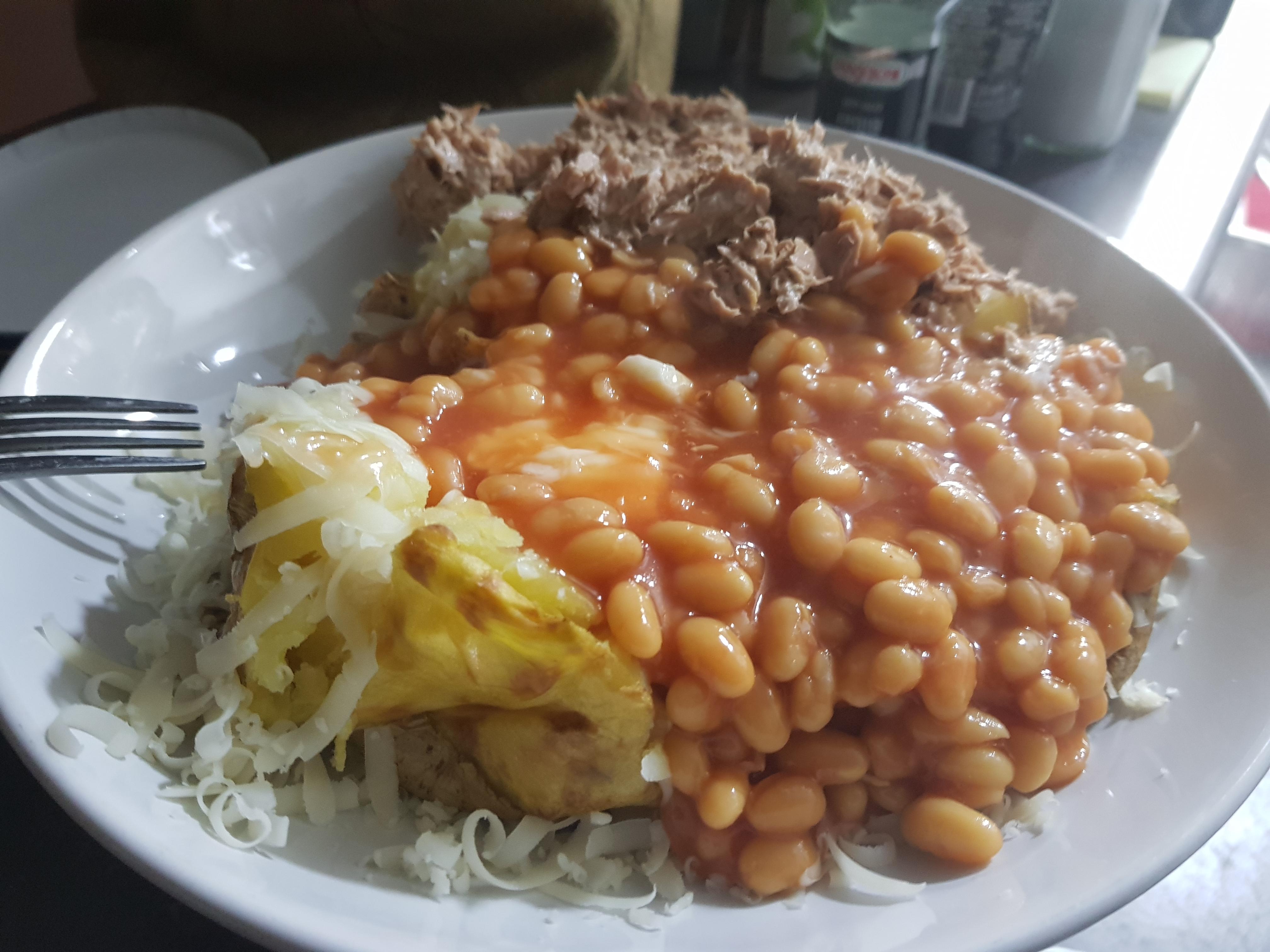 Classic Monday evening dinner... two baked potatoes covered in cheese