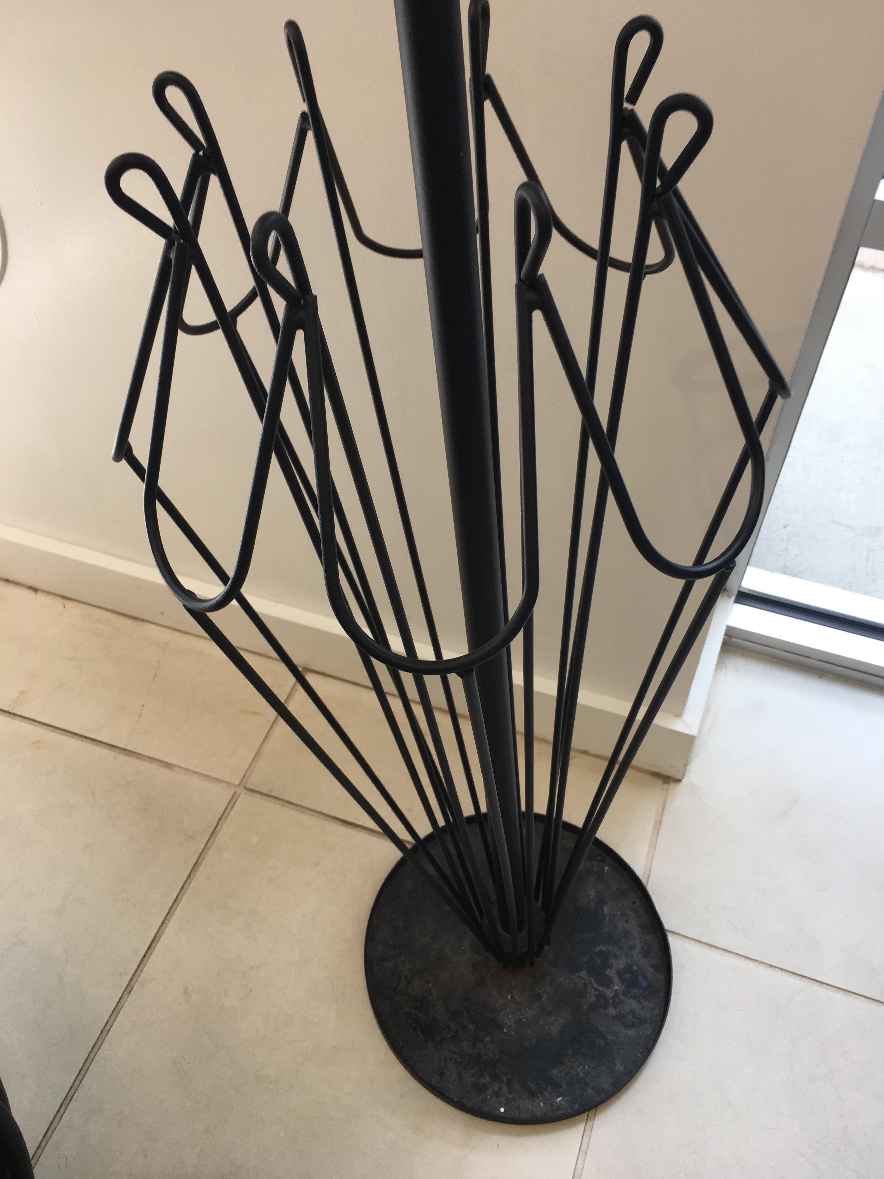 An umbrella stand shaped like an umbrella! r/pics