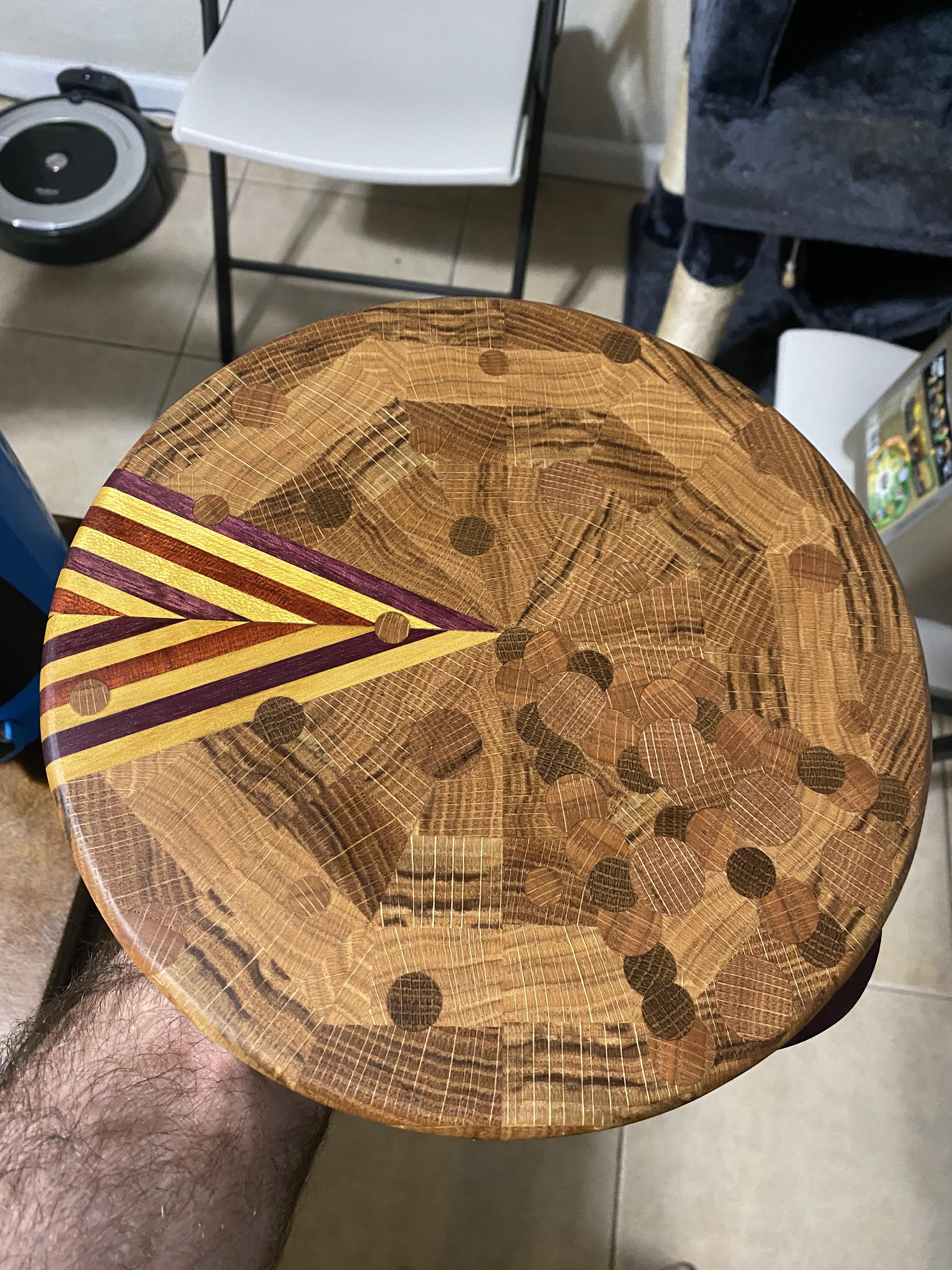 Oak, oak dowels, Purple Heart, yellow heart, and blood wood. Made to