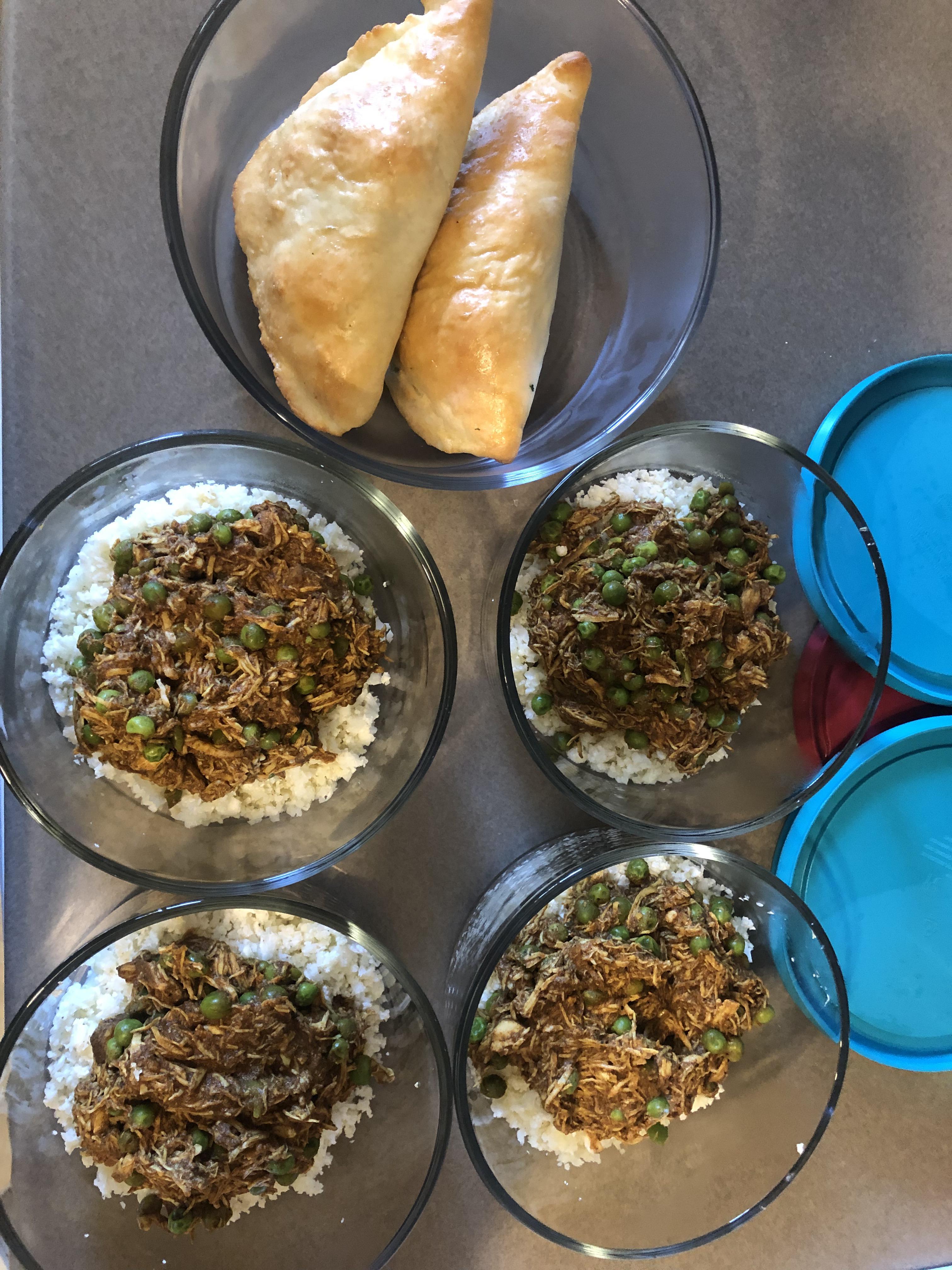 Crock pot chicken tikka masala over cauliflower rice, and spinach