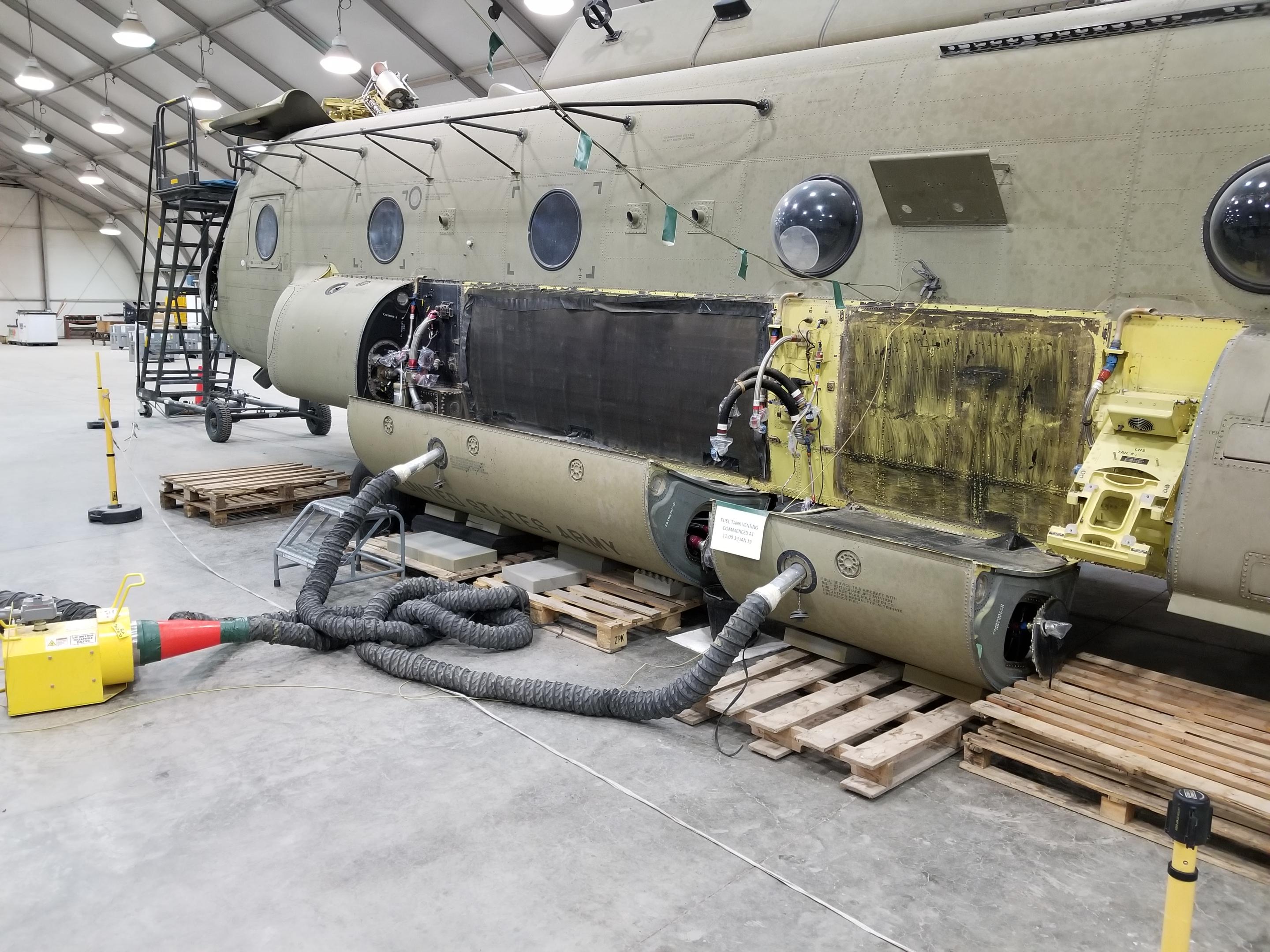 Dropped a few of our Chinook's fuel tanks for inspection. Venting the