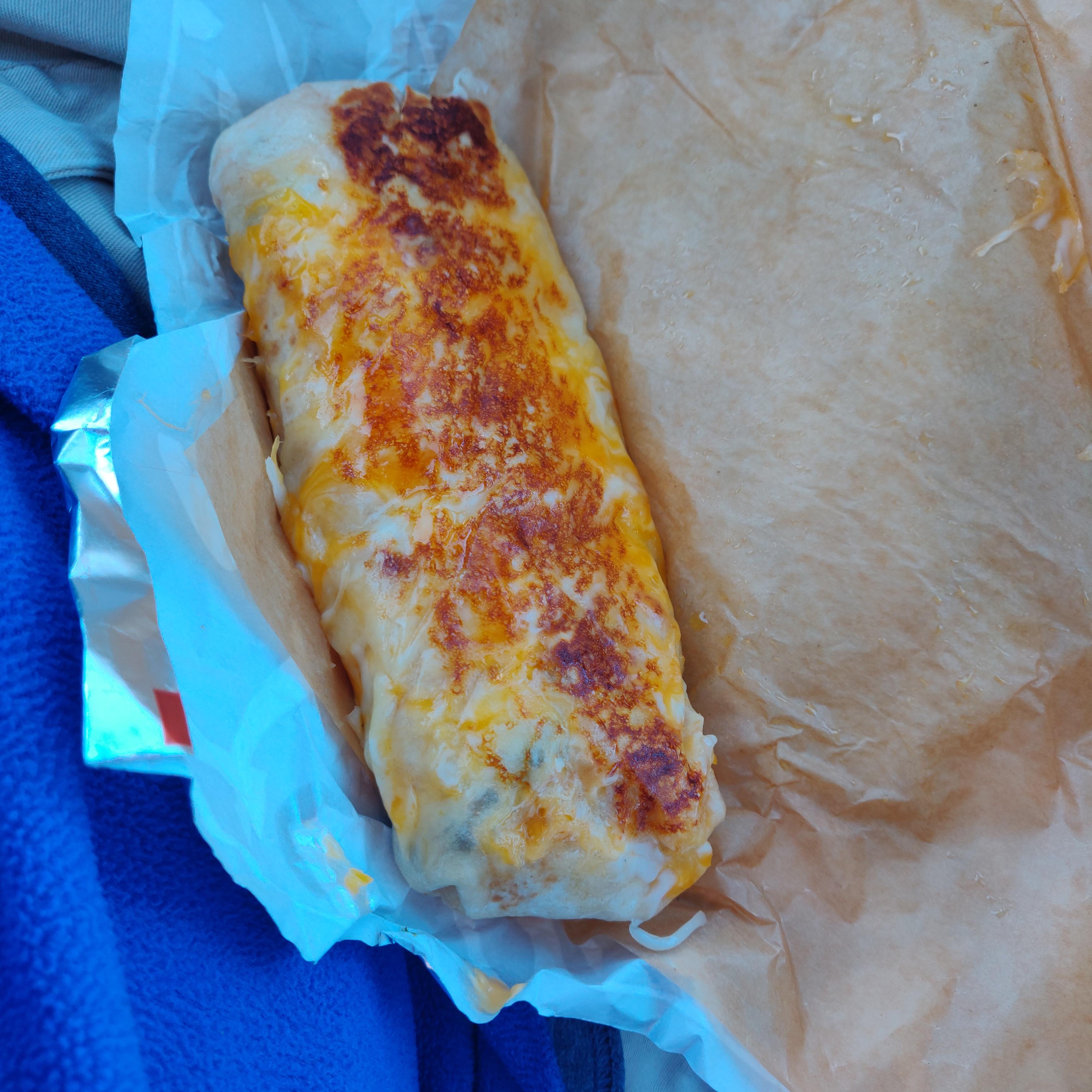 Steak grilled cheese burrito( ate with 10 packets of hot sauce) r