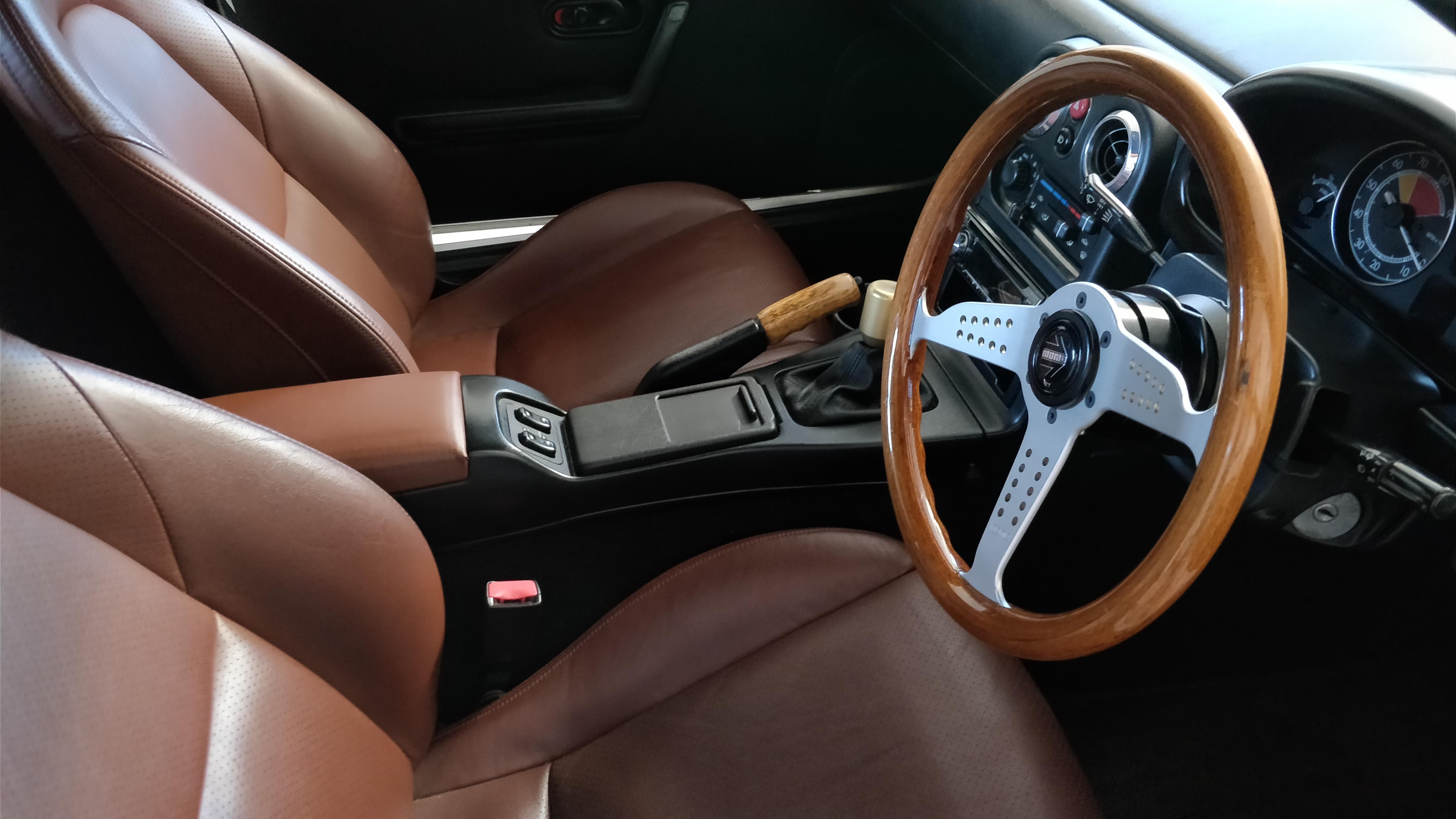 NB seats in an NA. Added leatherette on the armrest to match. And of