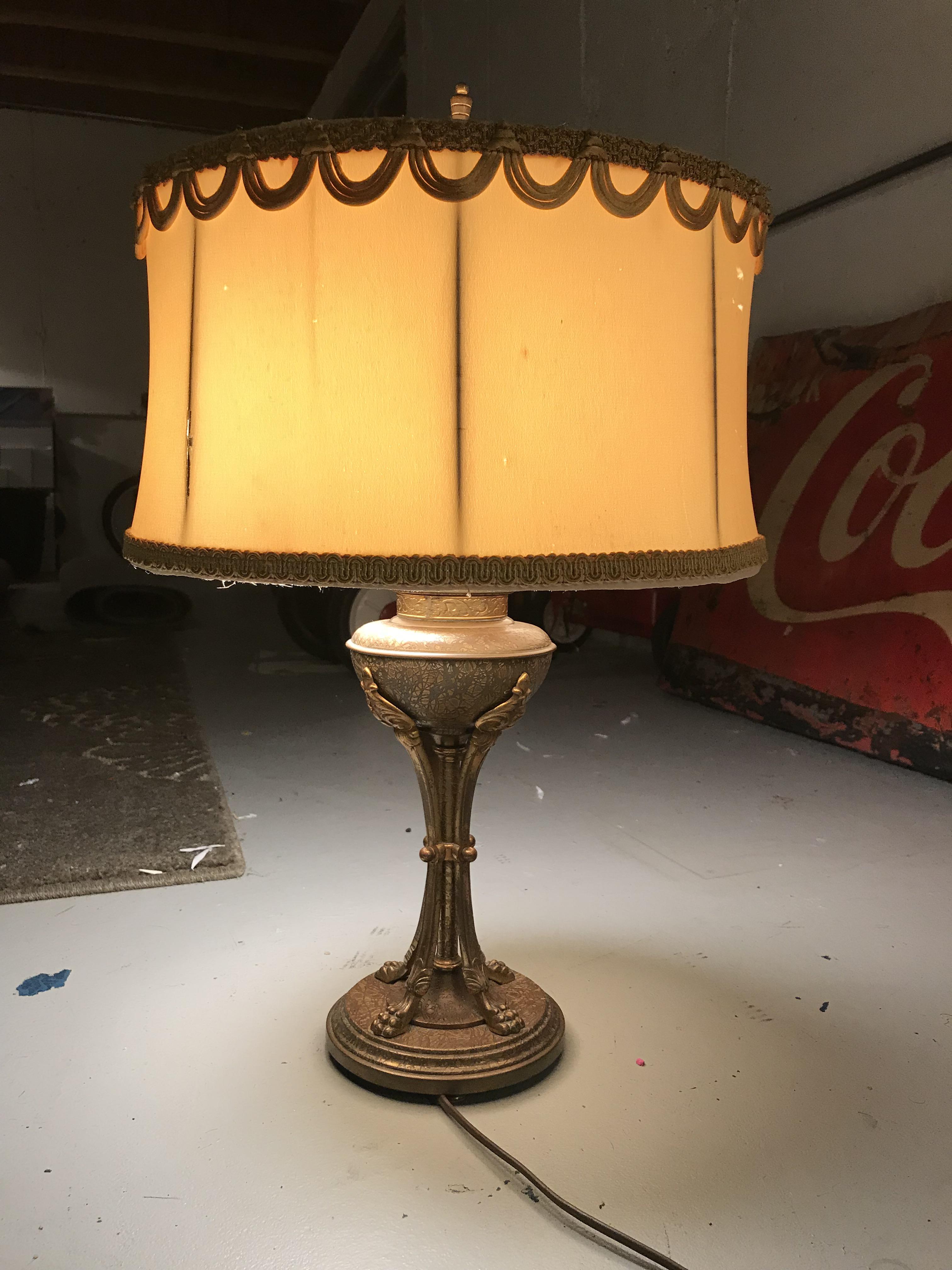 I need help identifying and old lamp. I believe it’s brass. I have more
