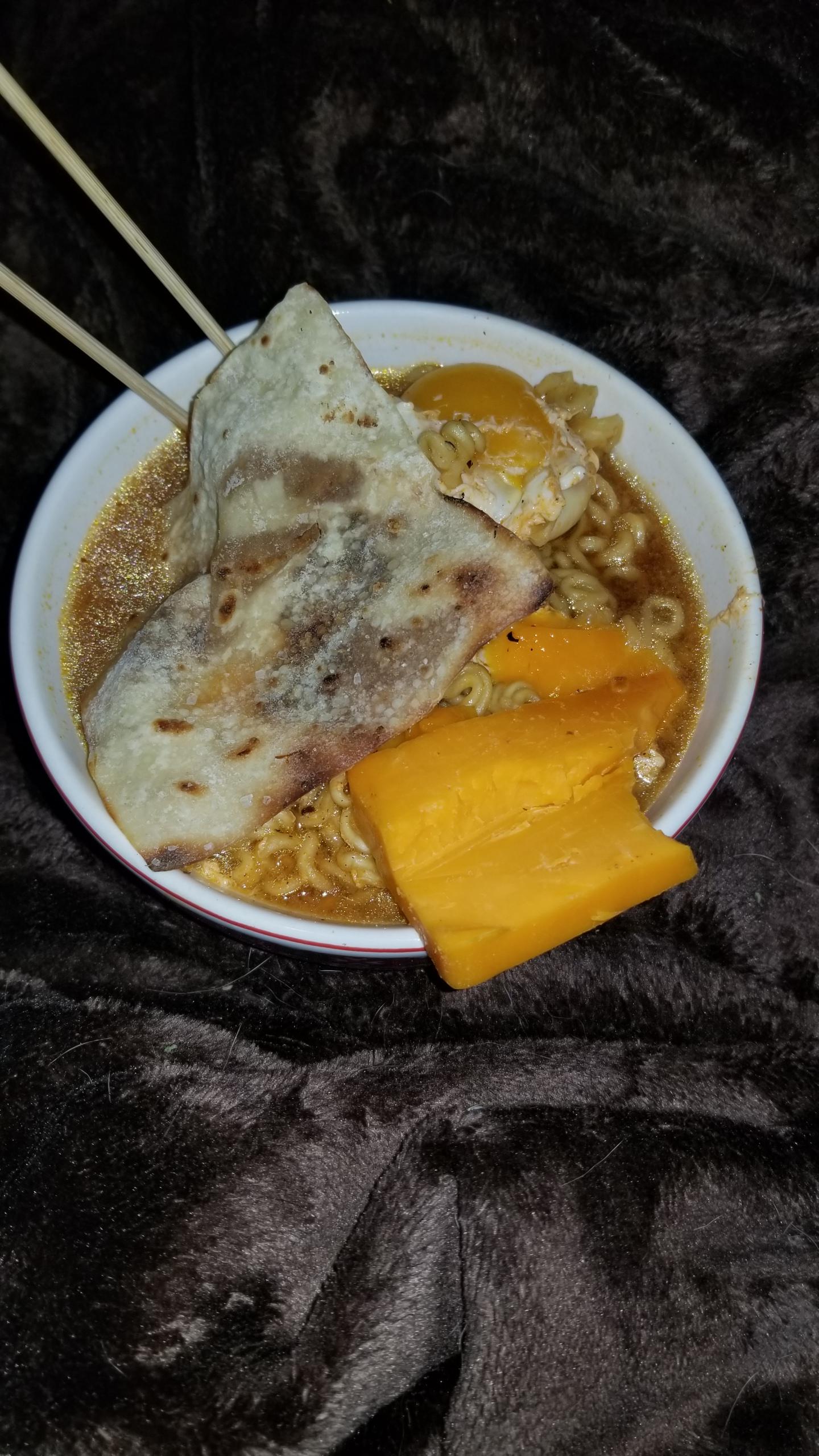Shin Black, Egg, Cheddar Cheese, Homemade Wonton Crisp, Soy Sauce r/ramen