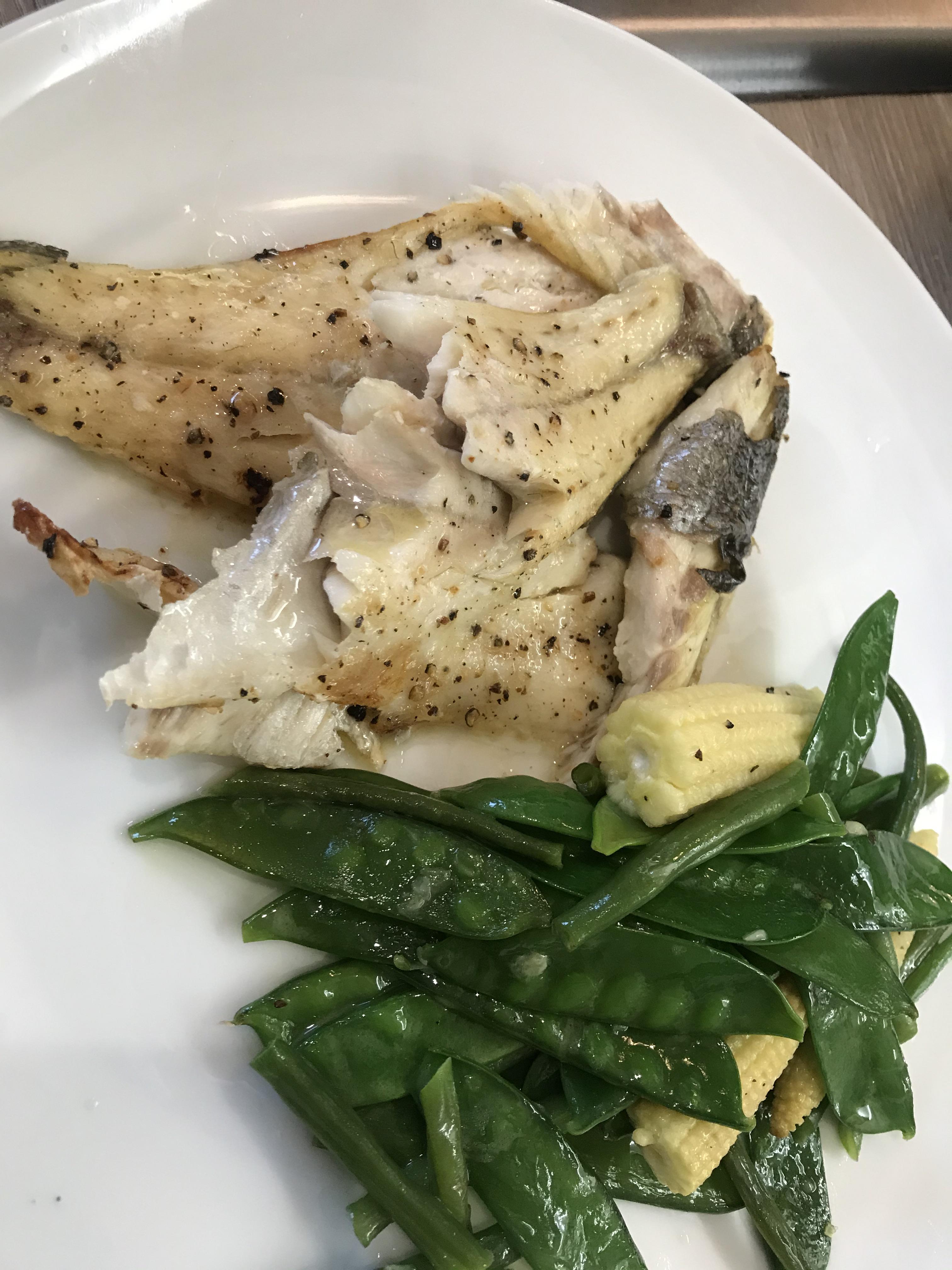 Simple but tasty grilled sea bass with veg cooked butter seasoned with