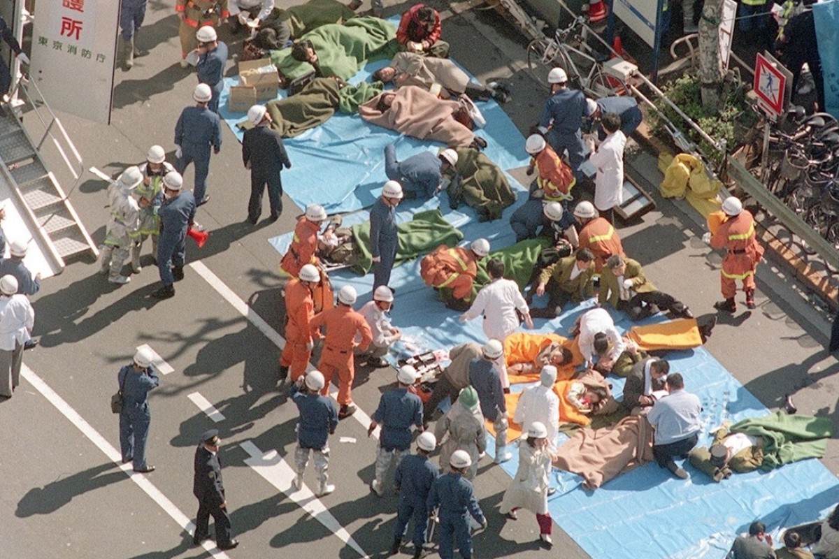 Subway passengers affected by sarin nerve gas are treated near Tsukiji