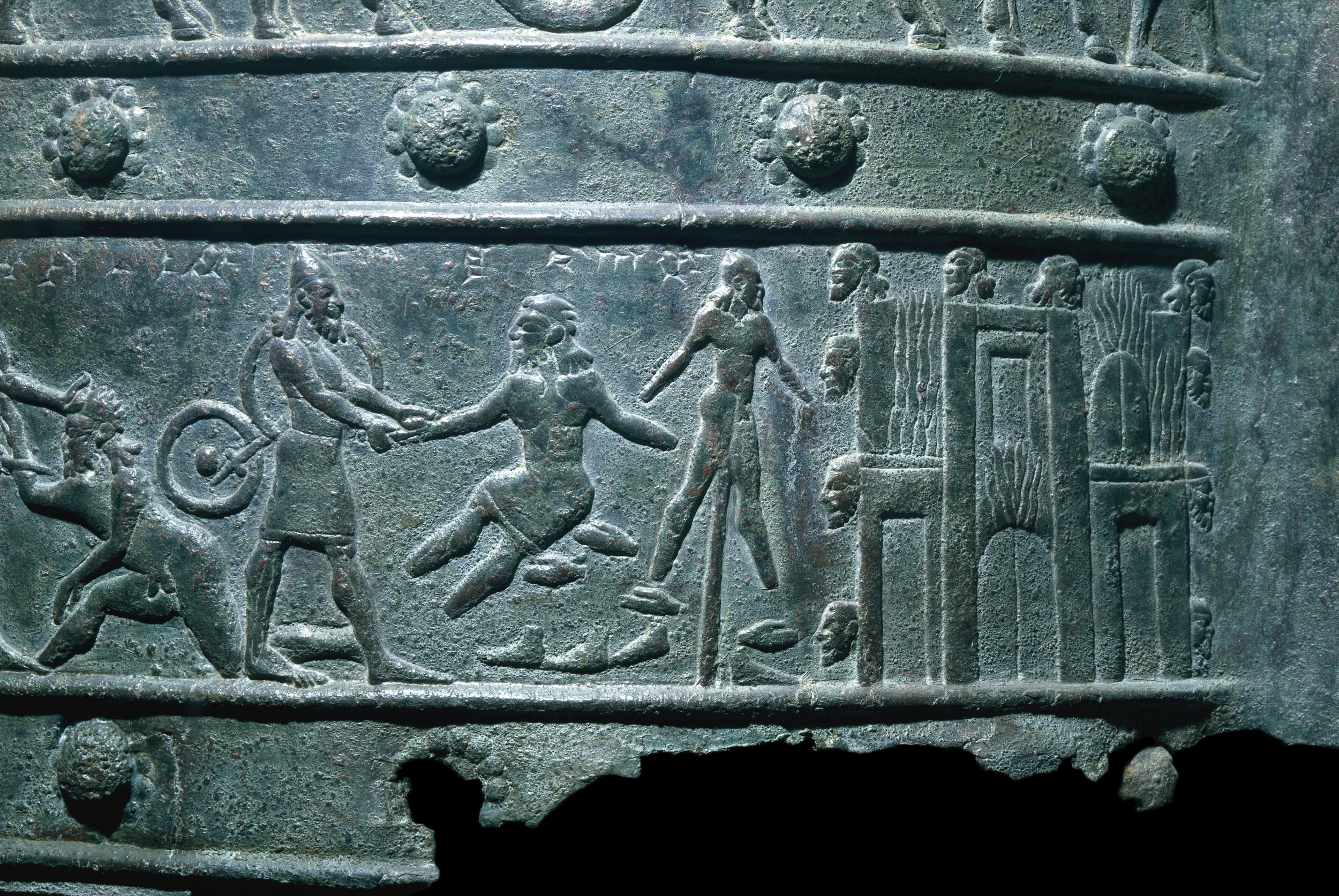 A bronze band from the Balawat Gates of Shalmaneser III depicting an Assyrian, surrounded by