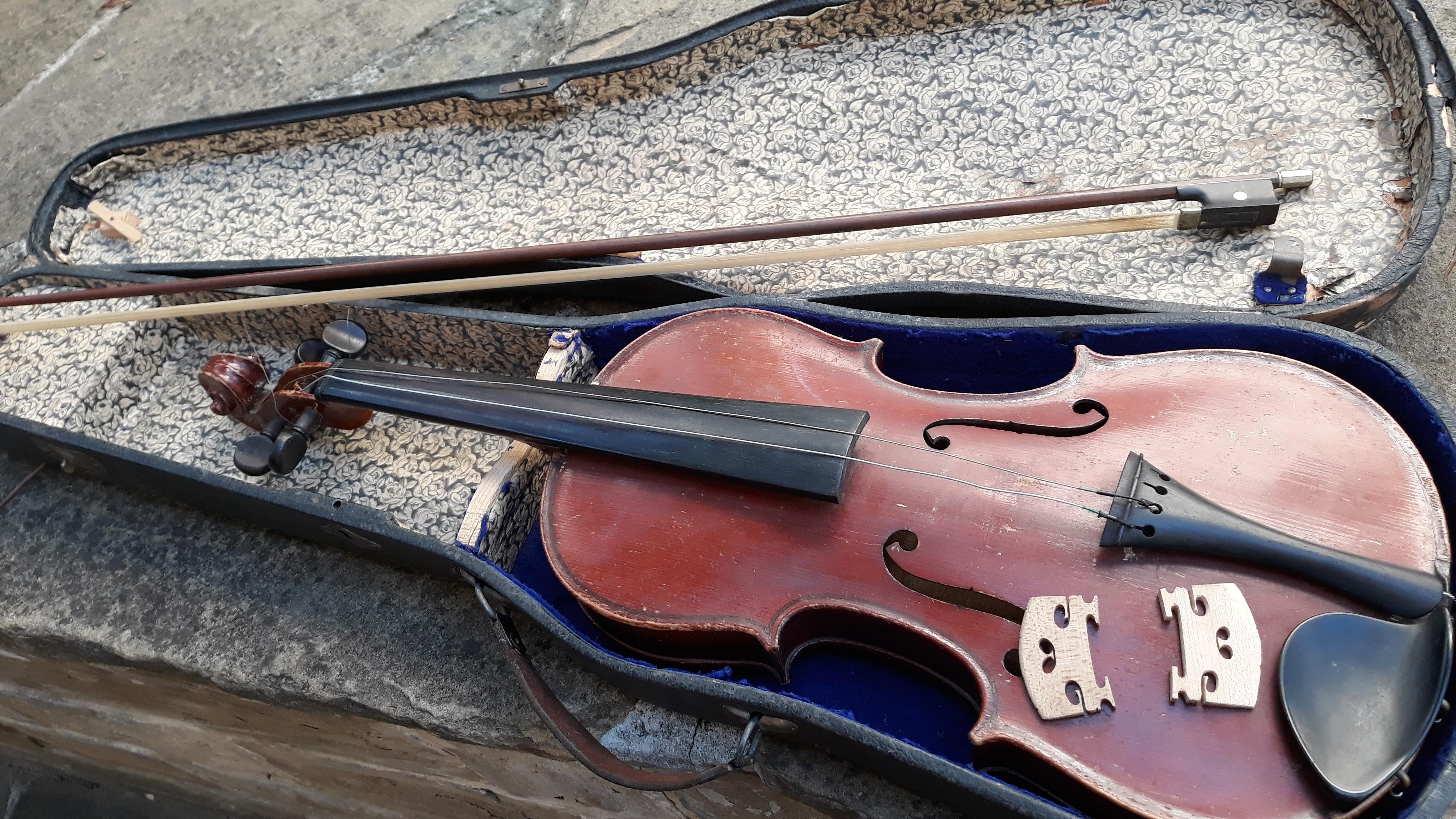 I just got a violin from my cousin. It's old and it needs restoration