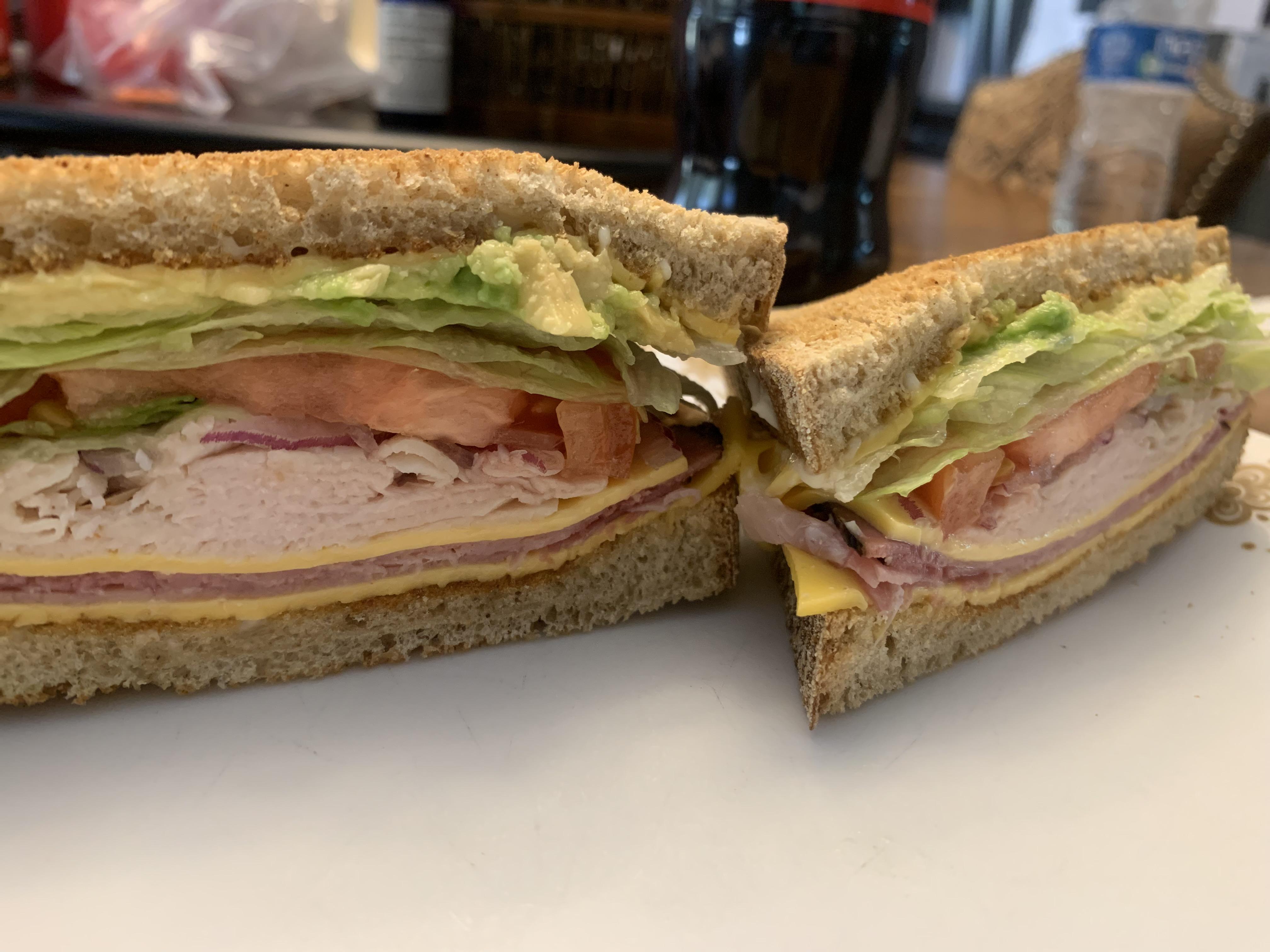 This turkey, ham, cheese, lettuce, onion, avocado, tomato, and mayo