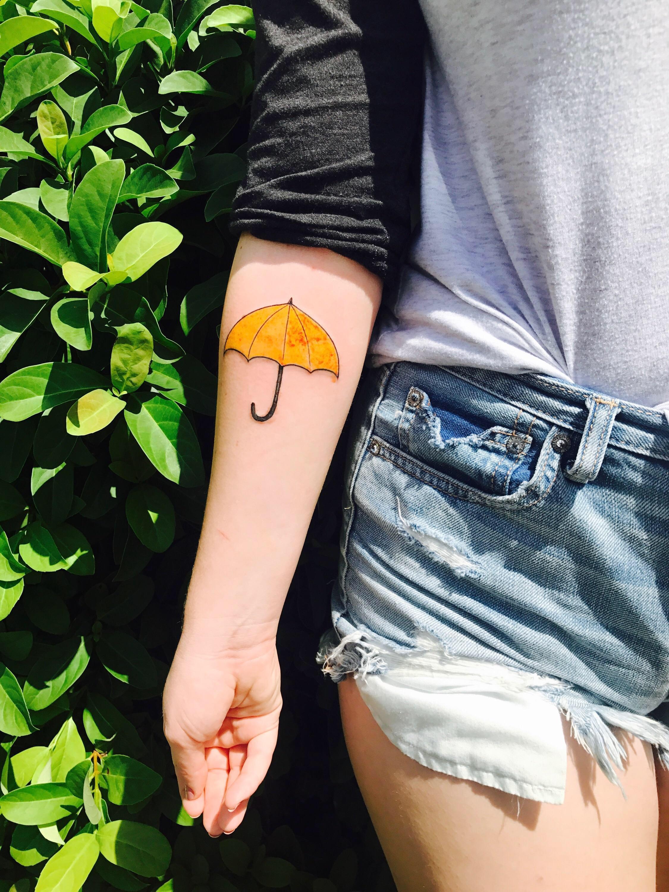 Thinking of getting a yellow umbrella tattoo. I saw this