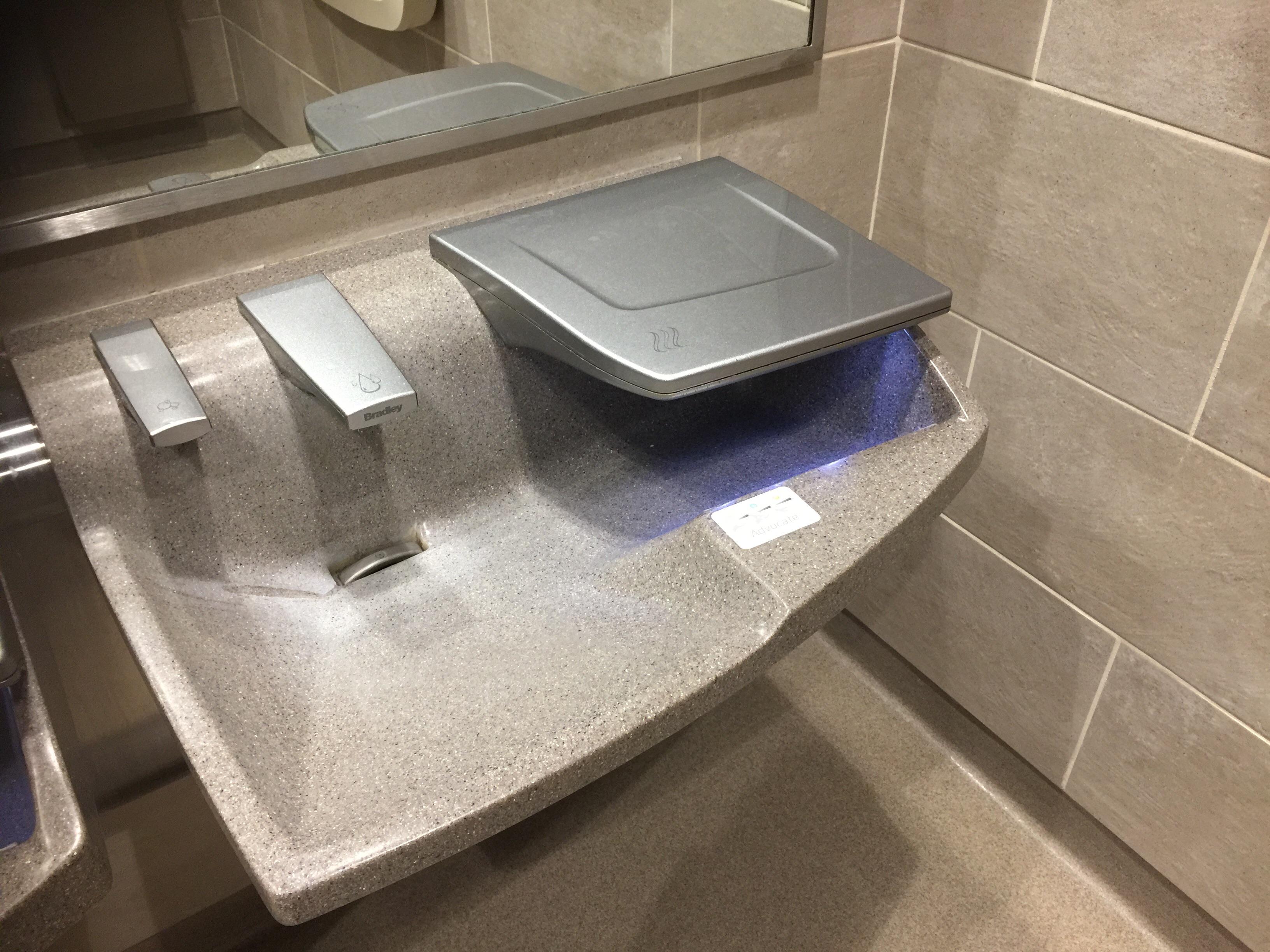 This handsfree soap dispenser, faucet and hand dryer all in one sink
