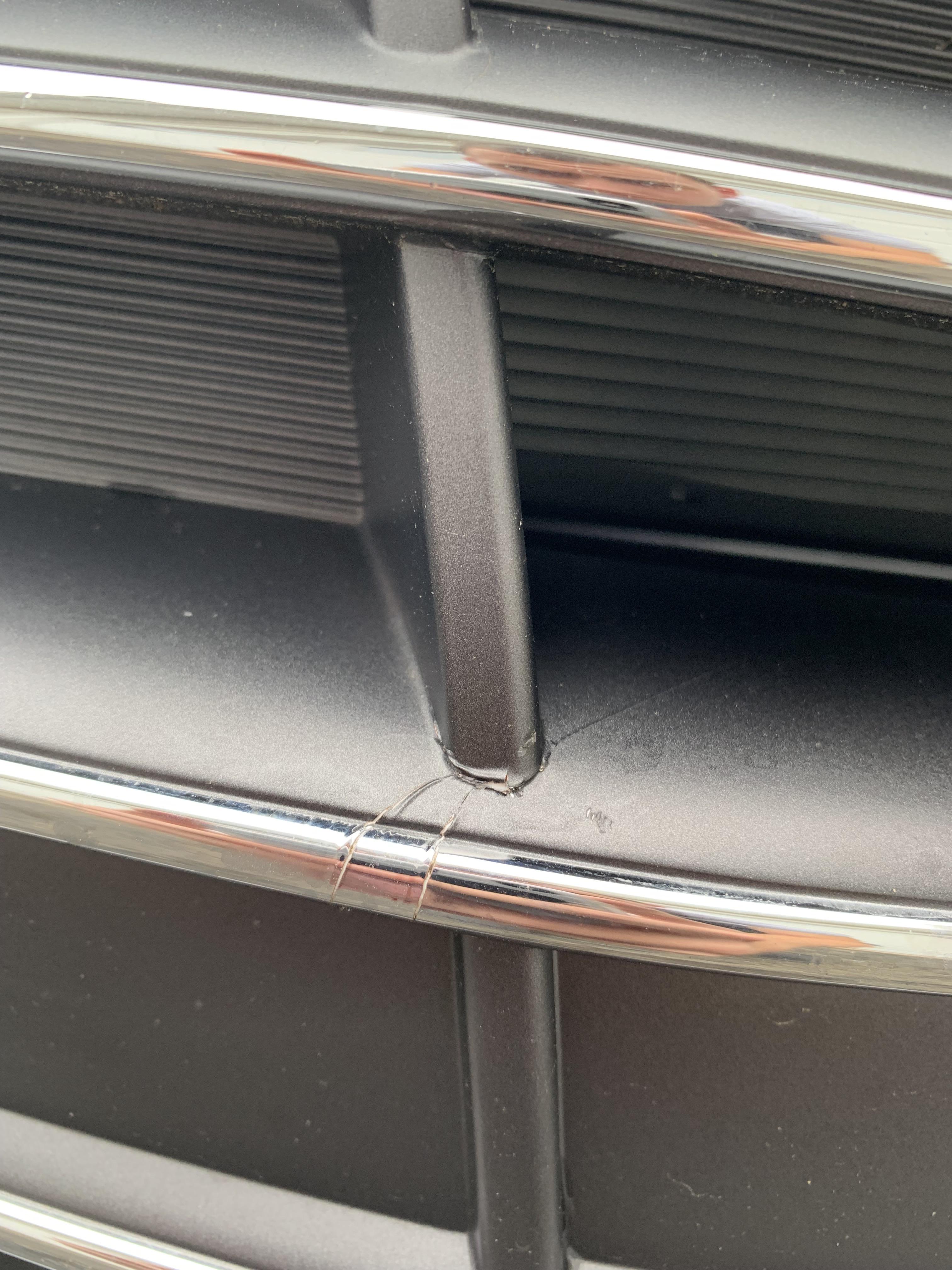 Front Grill Cracked. My mom tapped the front of my grill and it cracked