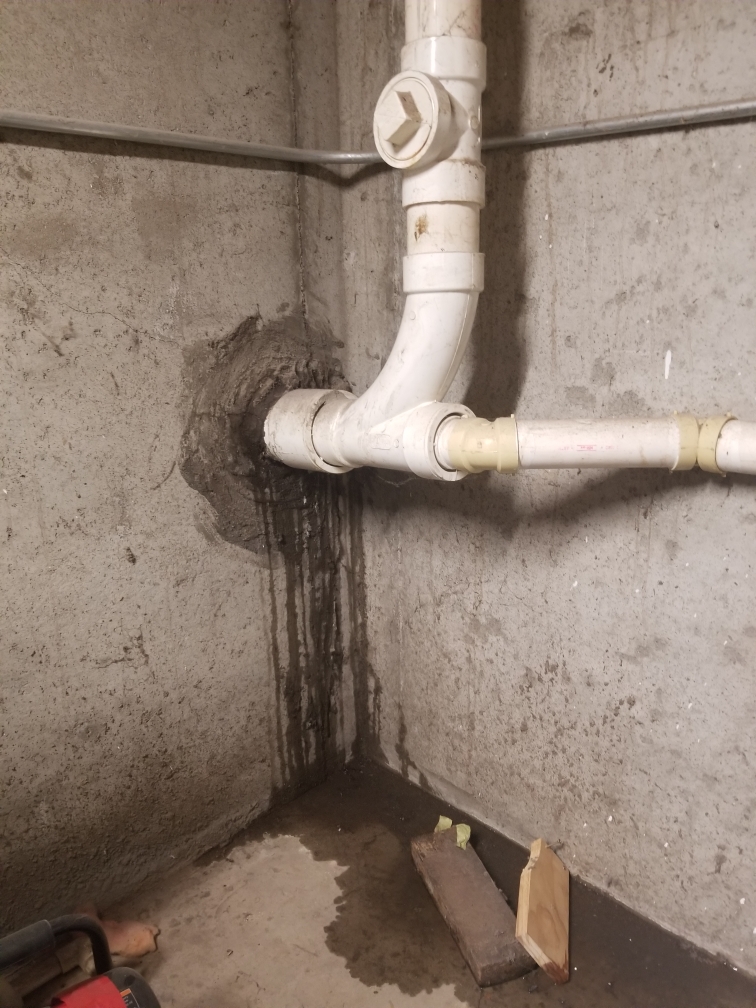 How can I seal my basement sewer drain pipe from having rain seep in