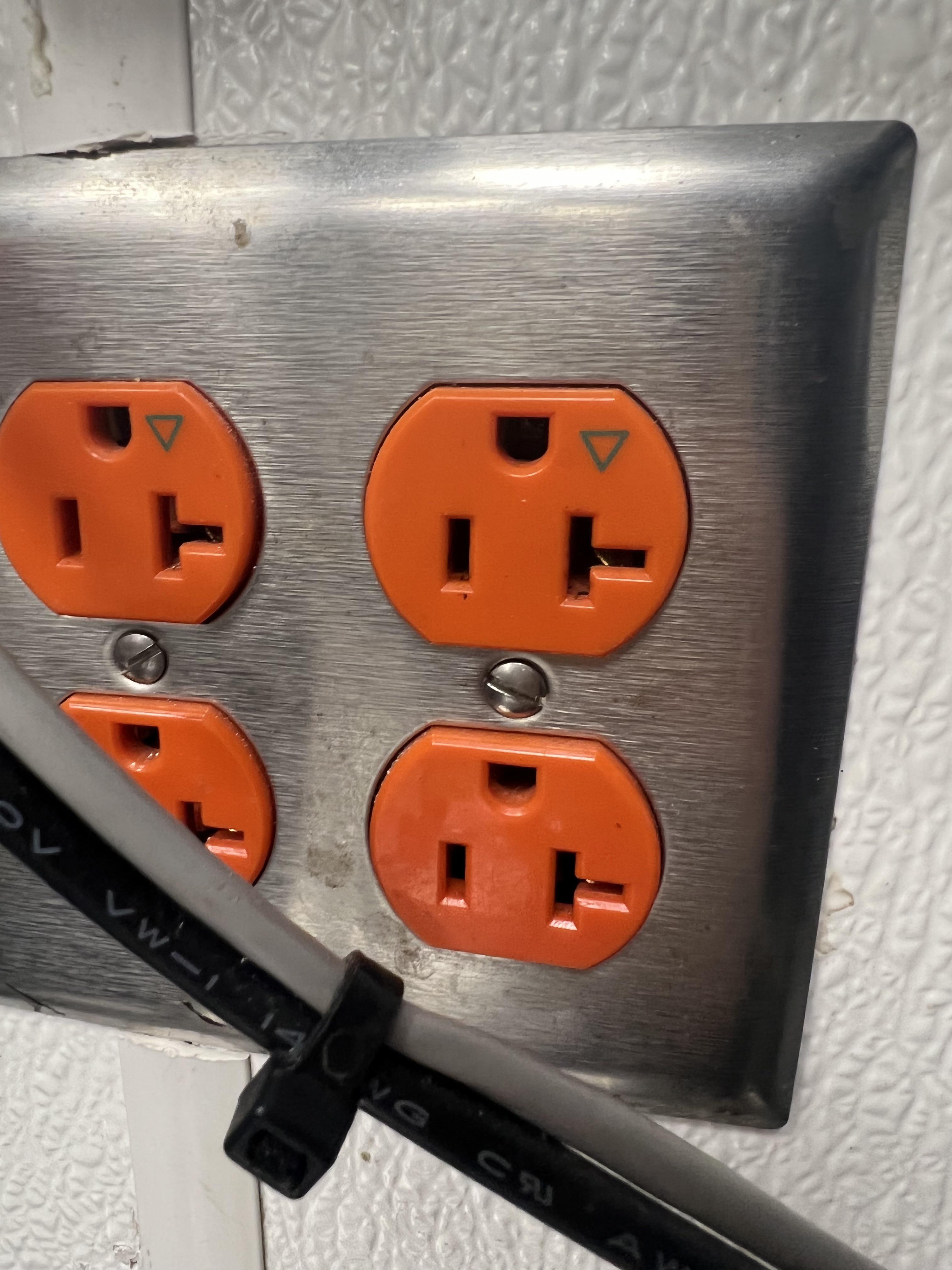 What does the green triangle indicate? My phone charger didn’t work in