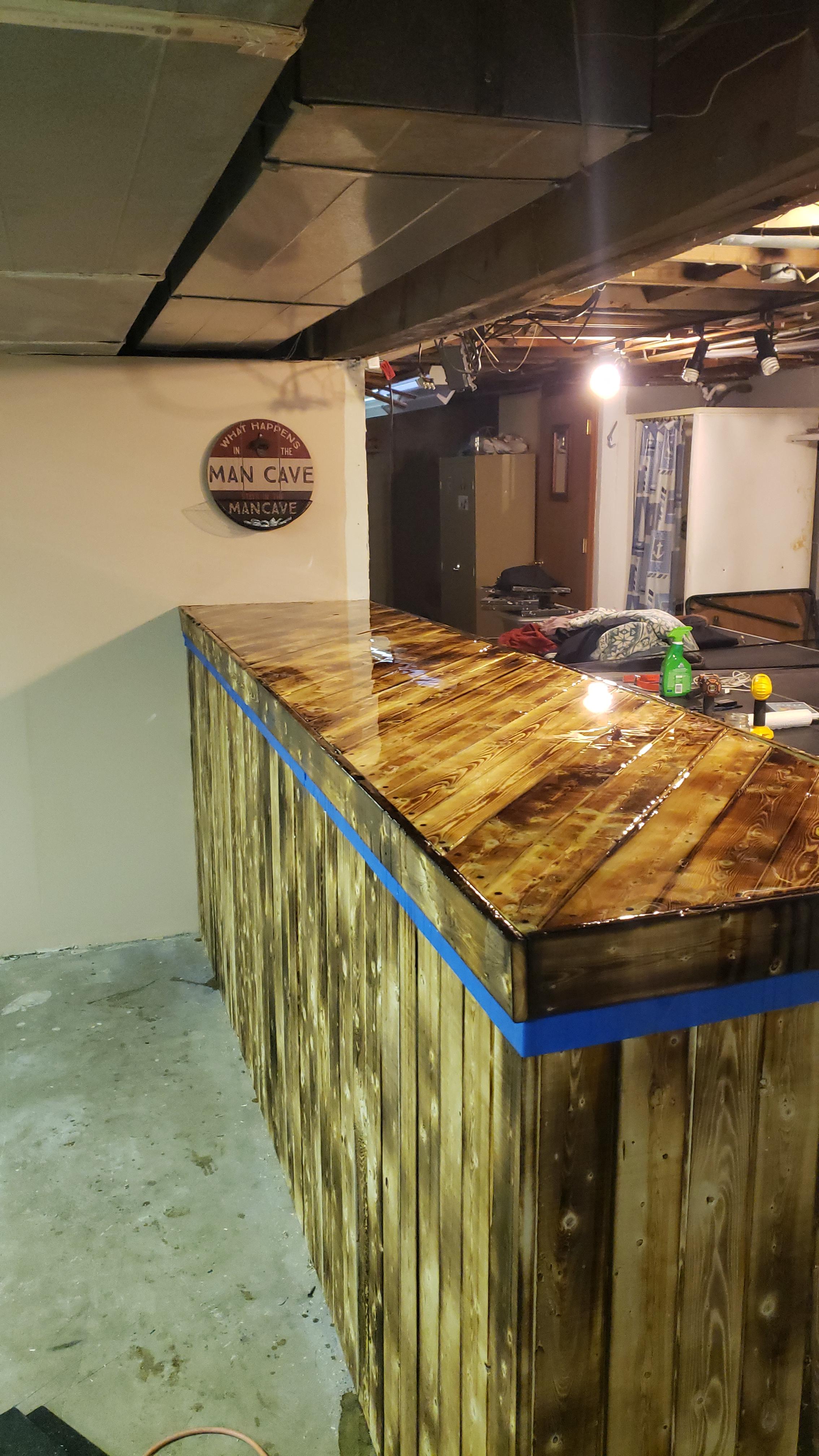 Burnt wood finish bar. Still gotta paint walls and floor, but its