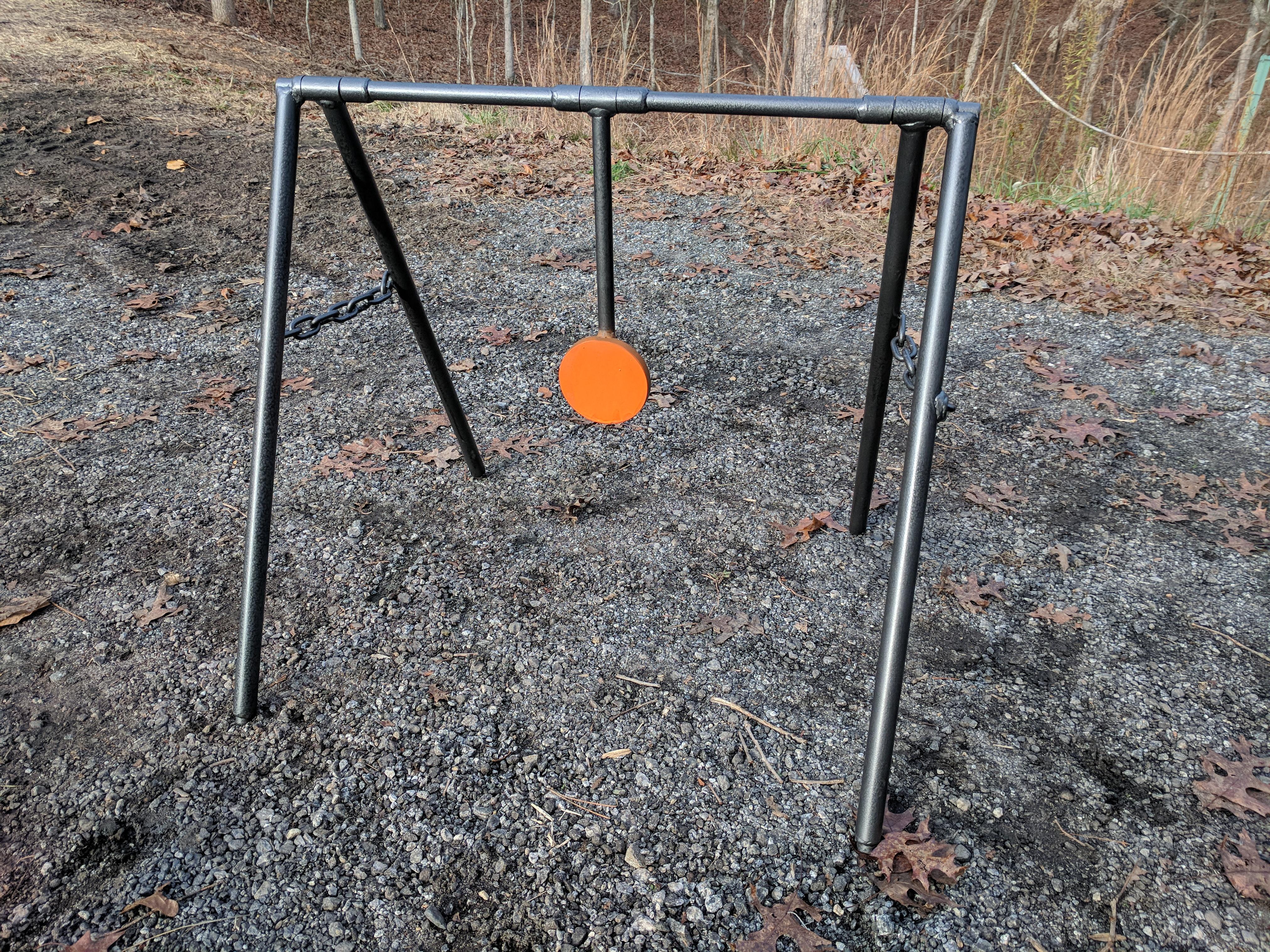 I designed and built a swinging shooting target for my dad. r/Welding