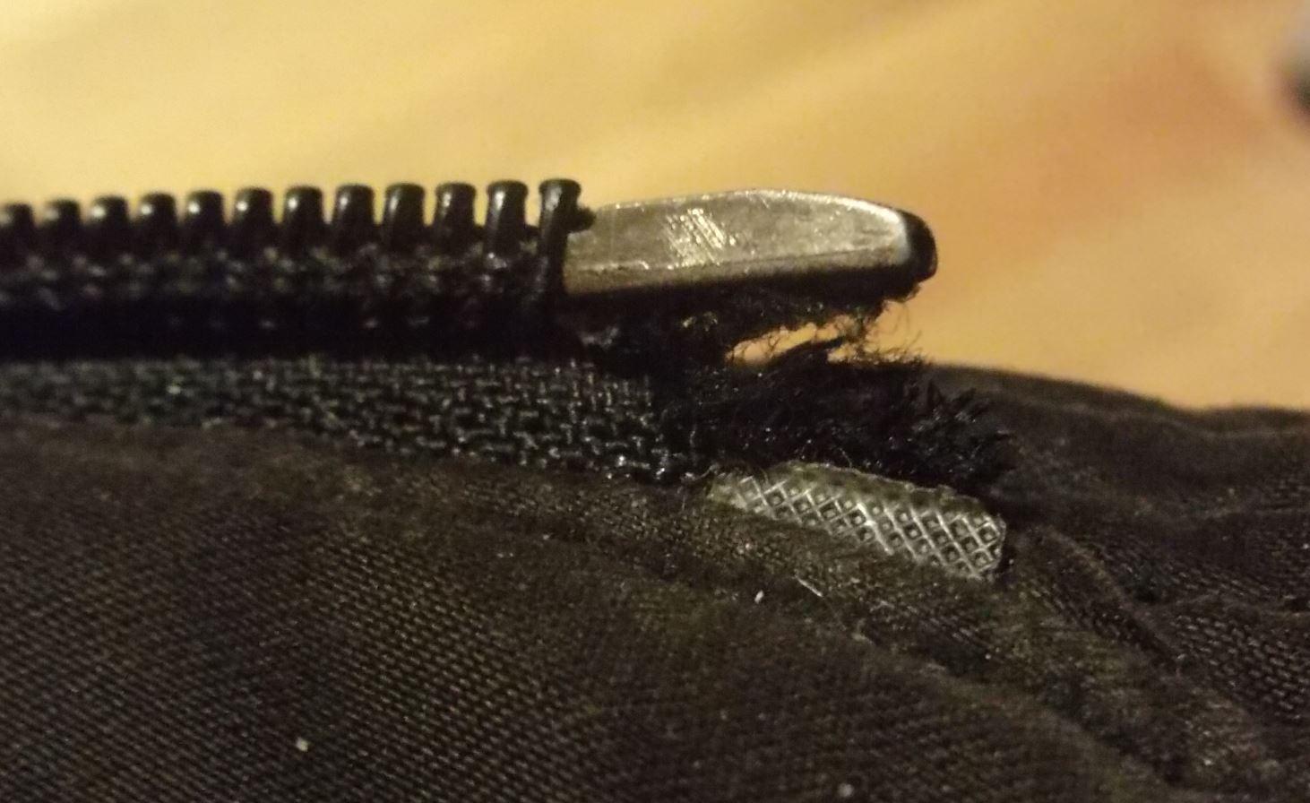 Q Can I fix this tear at the bottom of this zipper, or must I replace