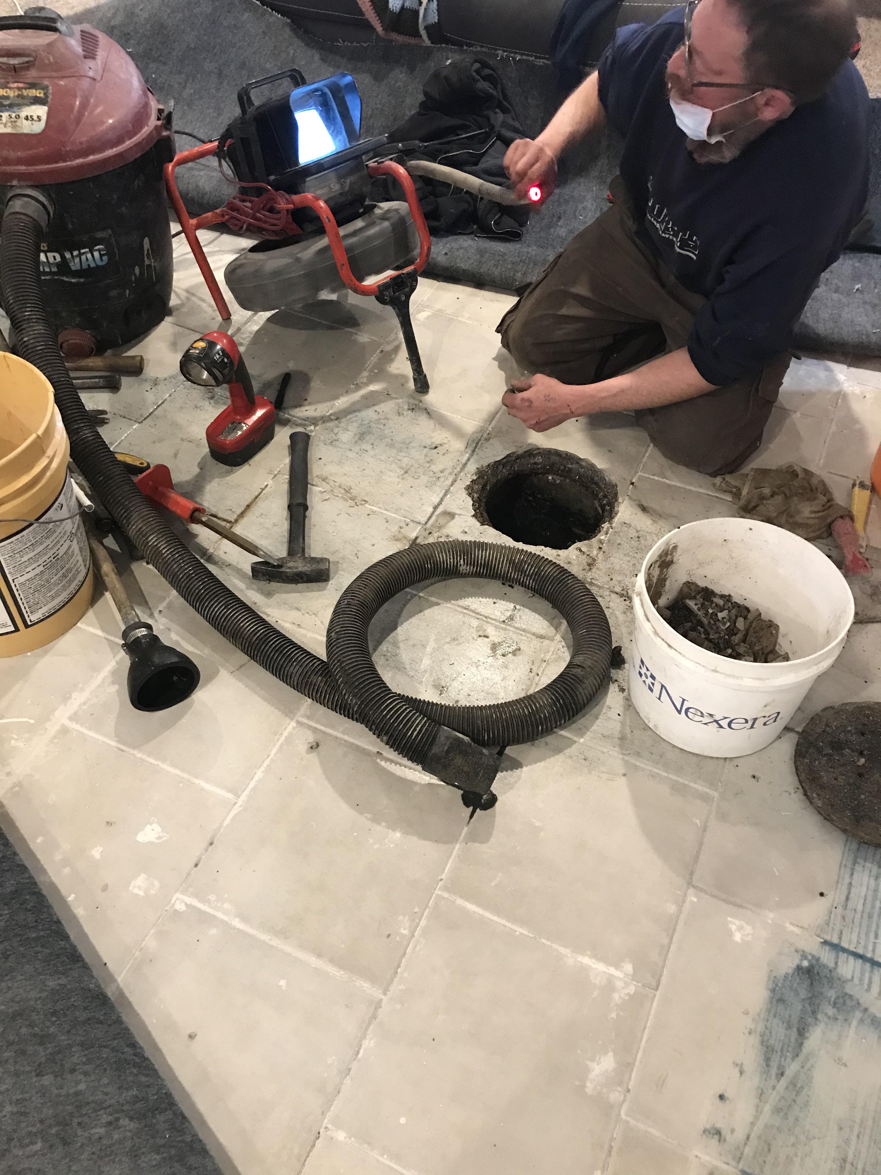 Top notch basement plumbing tile over the floor drain. r/Plumbing