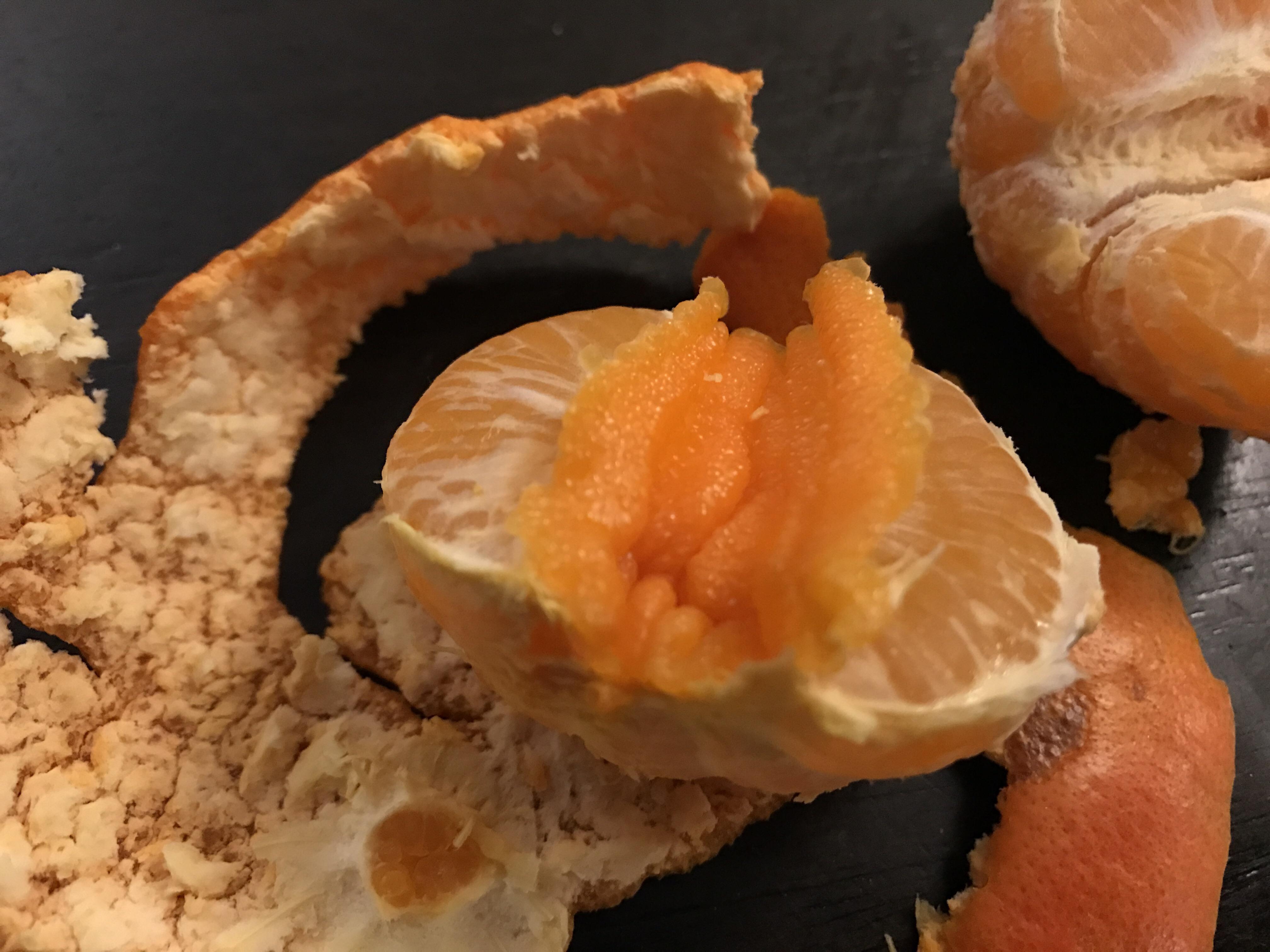This mandarin has peel on the outside and the inside r/mildlyinteresting