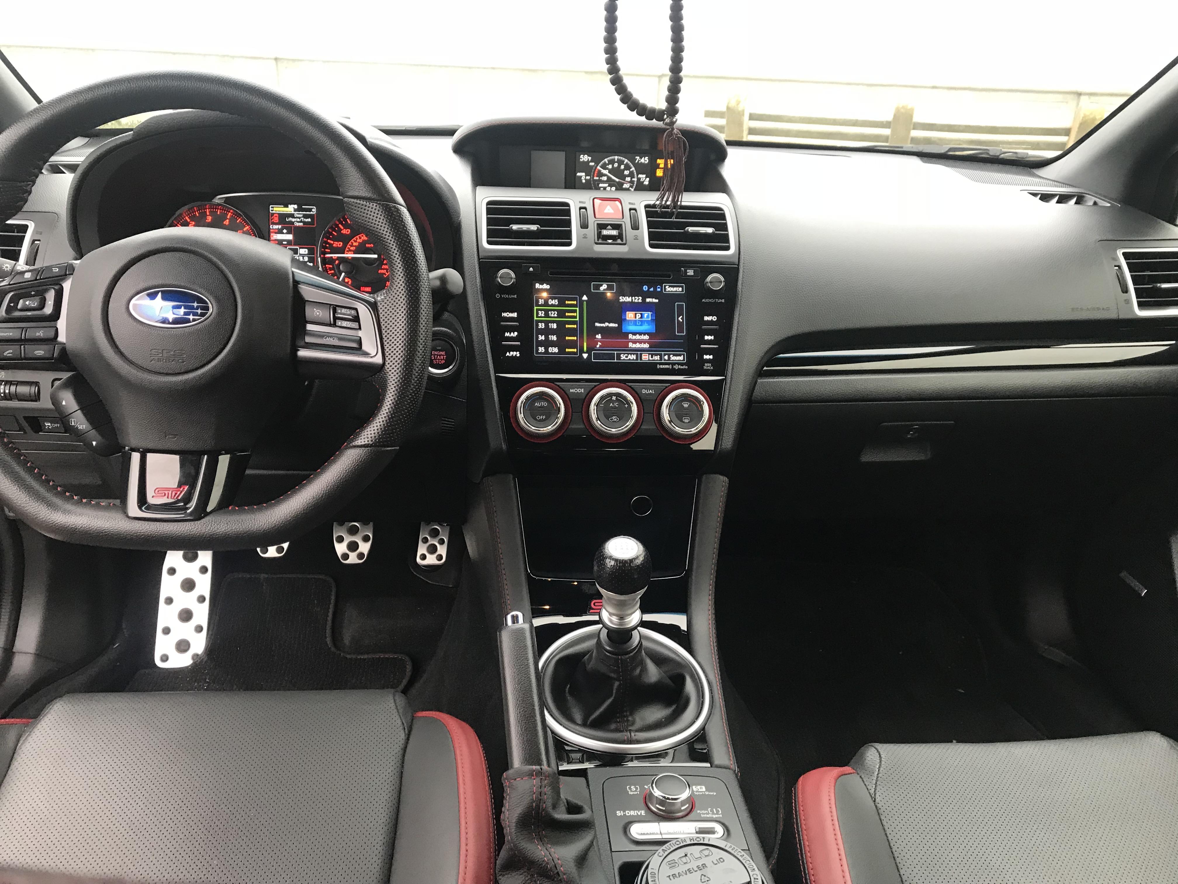 I upgraded my 17 sti with piano black oem interior parts from subispeed