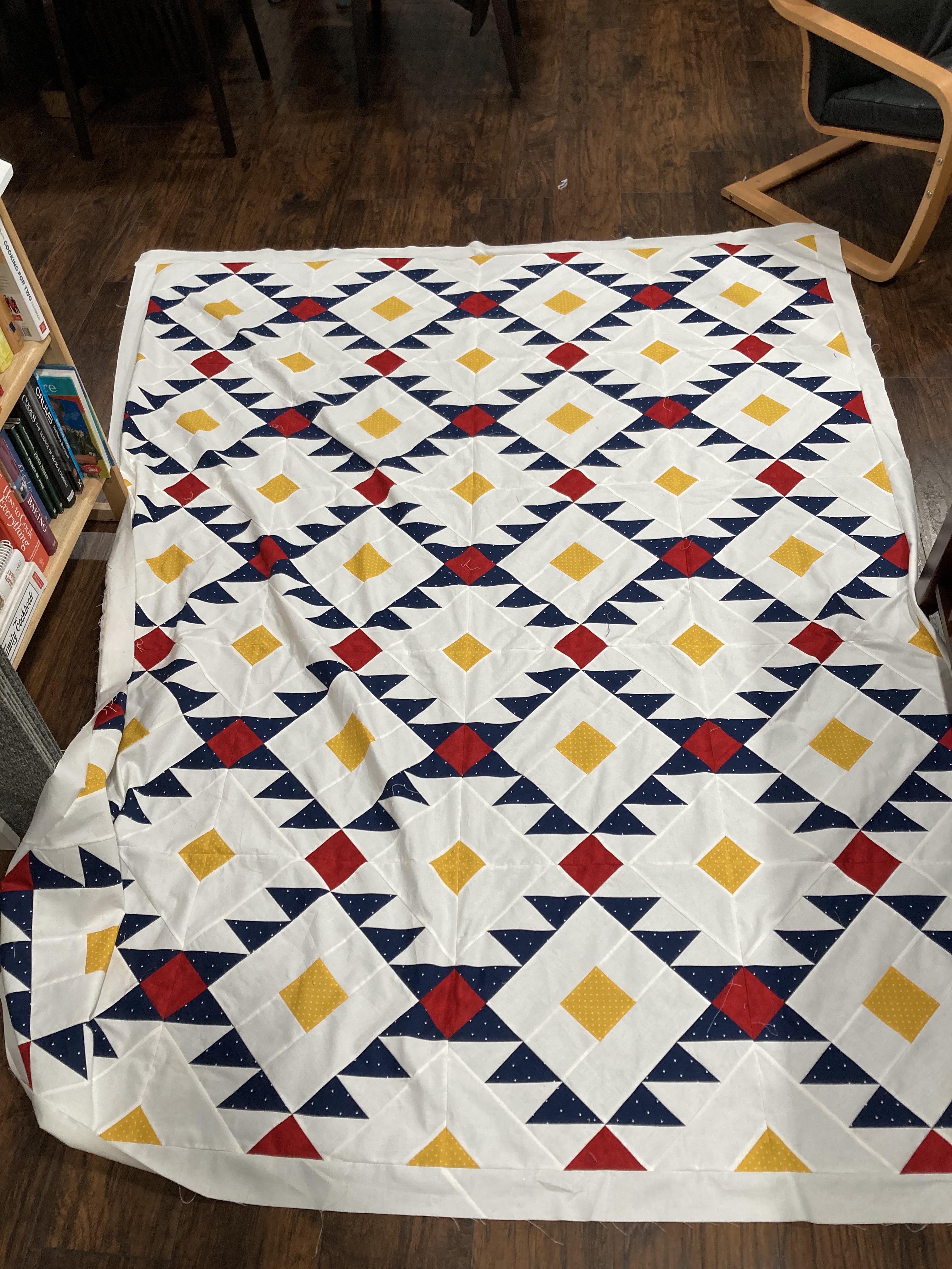 Finished a large twin size quilt top! I need suggestions on how to