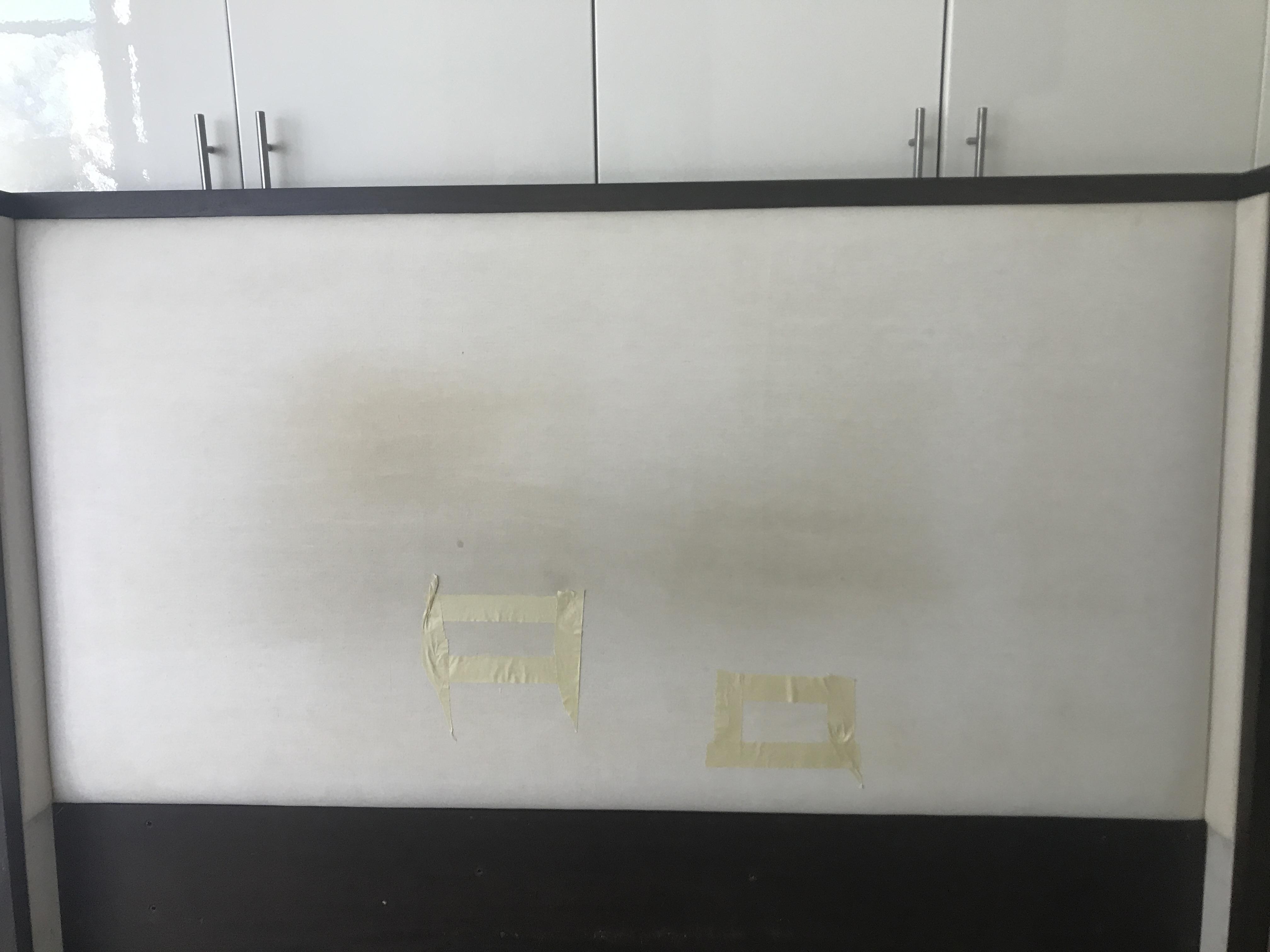 How would you clean grease stains (hair product) off this linen