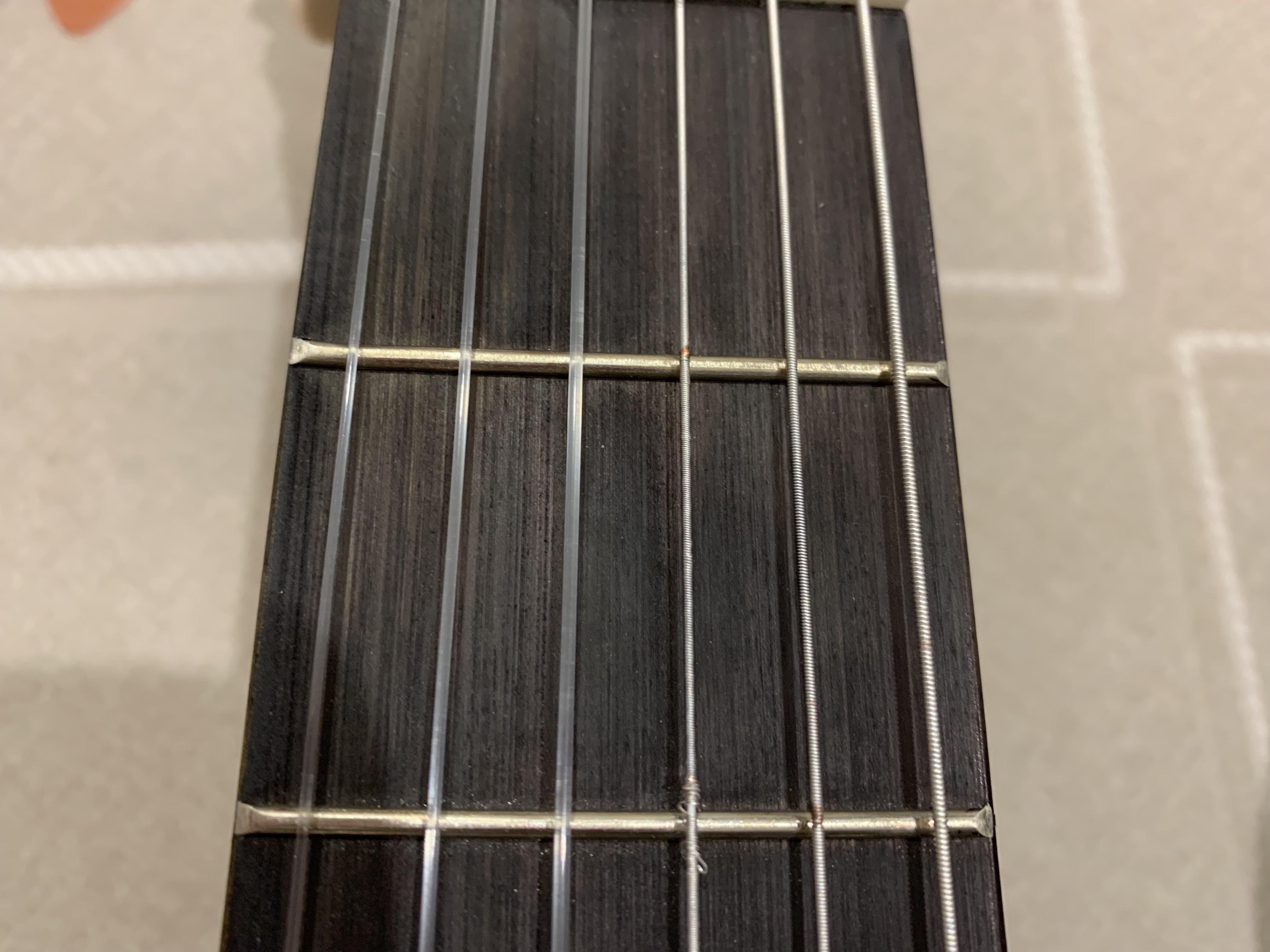 What the h is wrong with my bass strings at the frets? The 4th string