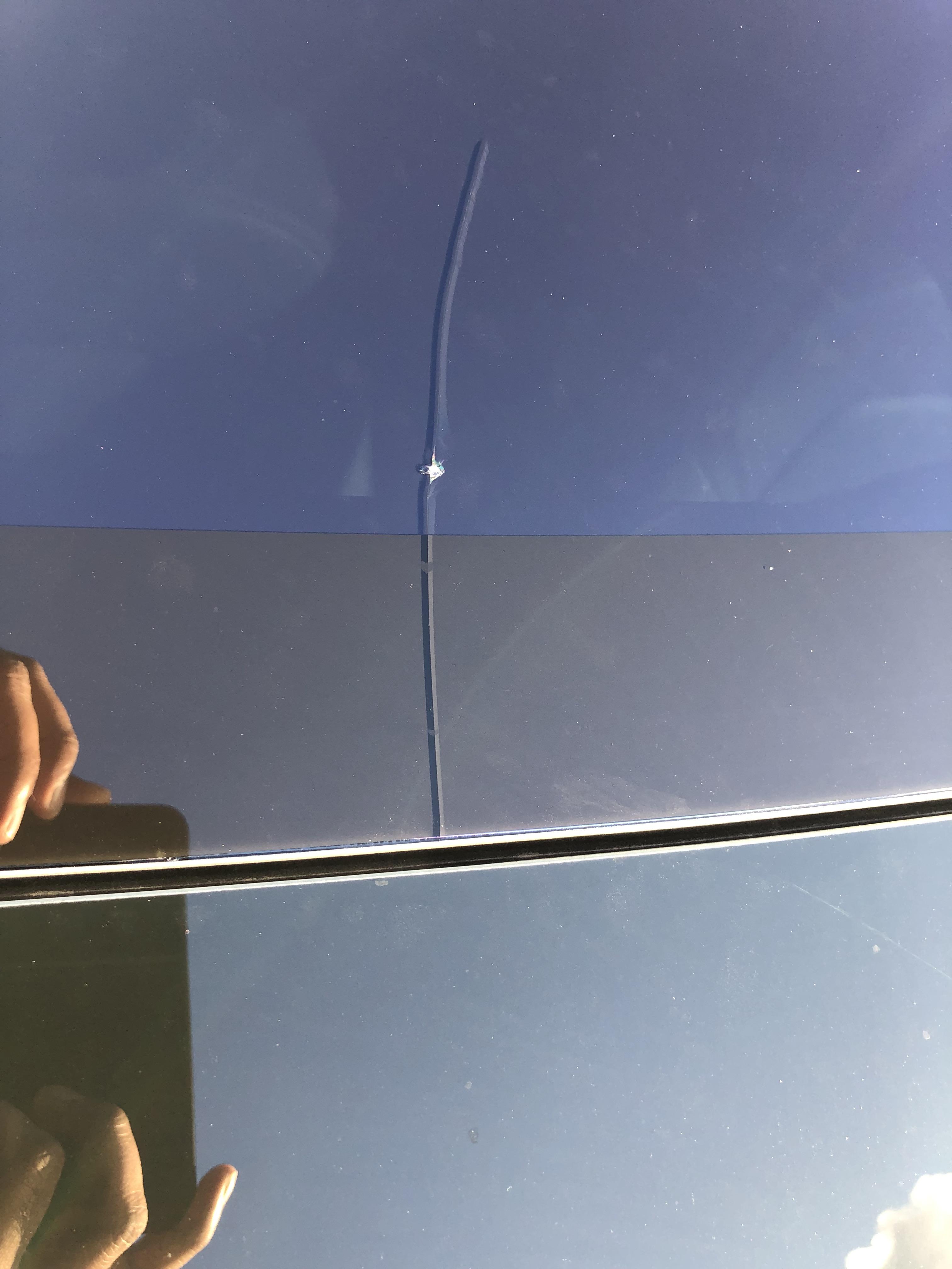 Rock chip has cracked the front sunroof panel on Model 3. Will Tesla SC